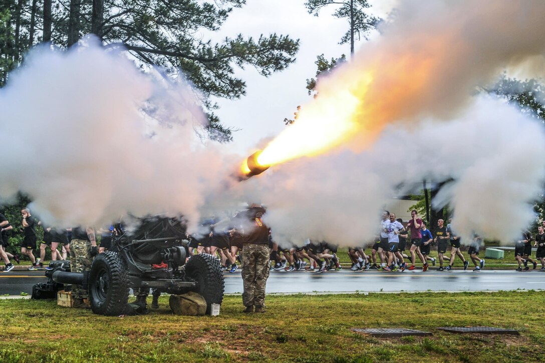 Paratroopers fire an M119 howitzer during the All American Week division run at Fort Bragg, N.C., May 22, 2017. The event celebrates the 82nd Airborne Division with events for soldiers and veterans of the division. Army photo by Sgt. Anthony Hewitt