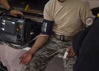 Emergency medical services practitioners perform an emergency response simulation for National EMS week at Holloman Air Force Base, N.M. on May 18, 2017. National EMS week, which kicks off May 22, 2017, was established in 1974, as a means to honor EMS practitioners and their contributions to families and communities across the United States. (U.S. Air Force photo by Airman 1st Class Alexis P. Docherty) 

