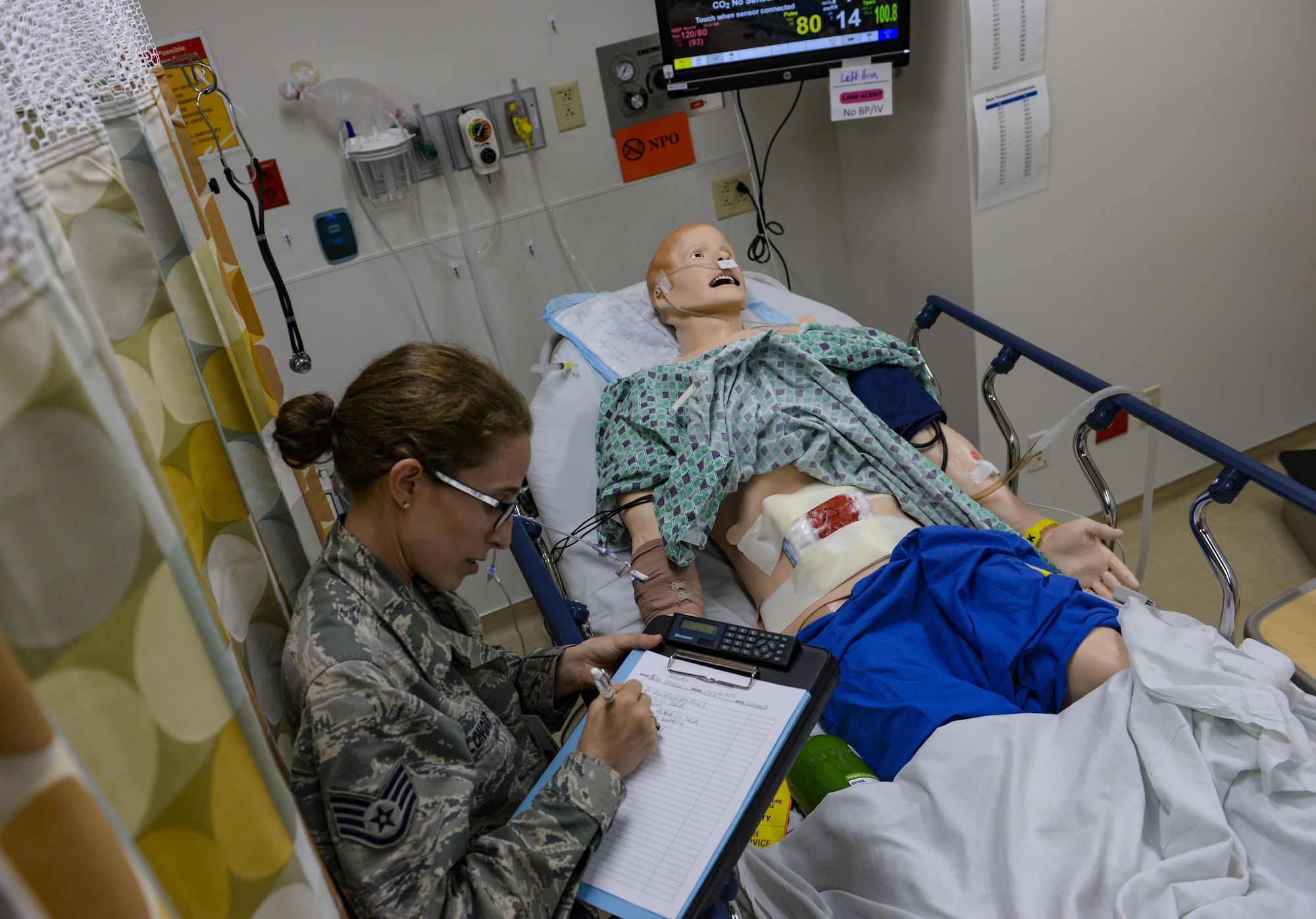 Staff Sgt. Jacquelyn Longar, 99th Medical Group aerospace medical technician, participates in the patient safety room of horrors event in the Mike O’Callaghan Medical Center at Nellis Air Force Base, Nev., May 10, 2017. The participants of the event had to identify as many safety violations as they could in five minutes. (U.S. Air Force photo by Airman 1st Class Nathan Byrnes/Released)
