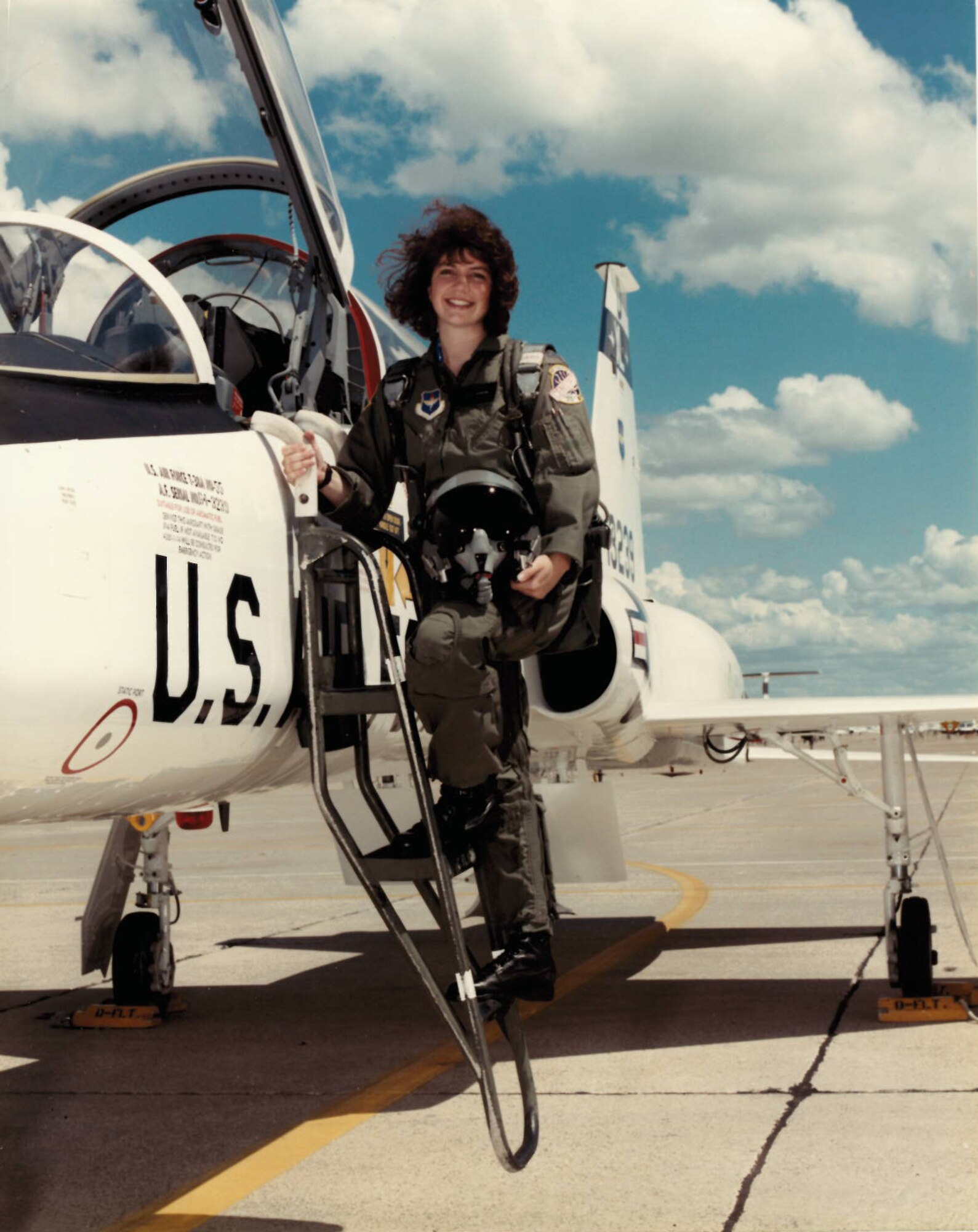 Col. Robyn Slade, 50th Space Wing senior individual mobilization augmentee to the commander, stands proudly with the t-38 she flew she flew at initial pilot training. Slade began her Air Force career within Public Affairs, but was able to pursue her dream of flying after years of hard work. (Courtesy photo)