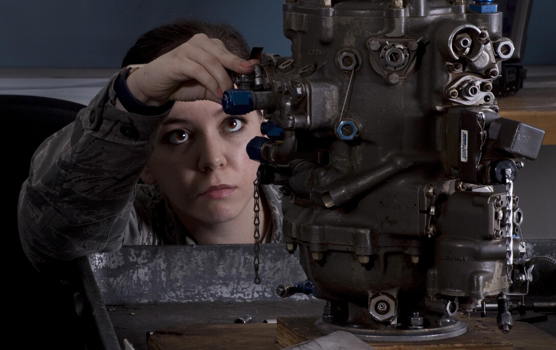 Staff Sgt. Angelica Ponce, 373rd Training Squadron Detachment 15 aerospace propulsion instructor, checks a student’s work on a C-130H Hercules training component, May 16, 2017, at Yokota Air Bare, Japan. C-130H maintainers from across the Indo-Asia Pacific region come to Yokota to take classes taught by the 373rd Training Squadron Detachment 15 instructors. (U.S. Air Force photo by Airman 1st Class Donald Hudson)