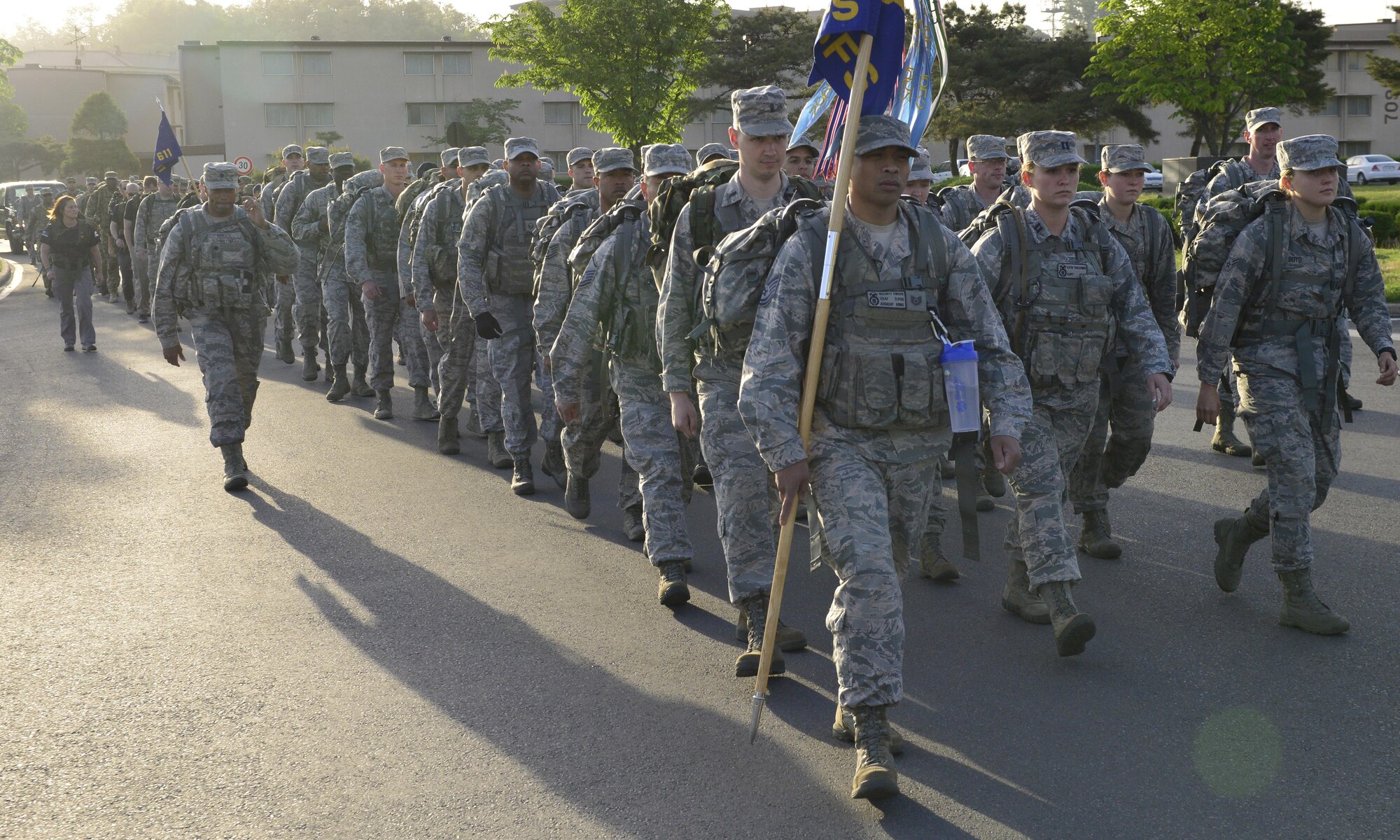 Team Osan members march in a memorial ruck to honor fallen peace officers at Osan Air Base, Republic of Korea, May 15, 2017. The ruck marked the beginning of Police Week activities for the base including a 5k run, warrior fitness challenge, Memorial Retreat Ceremony and police demonstration and display. (U.S. Air Force photo by Staff Sgt. Alex Fox Echols III)