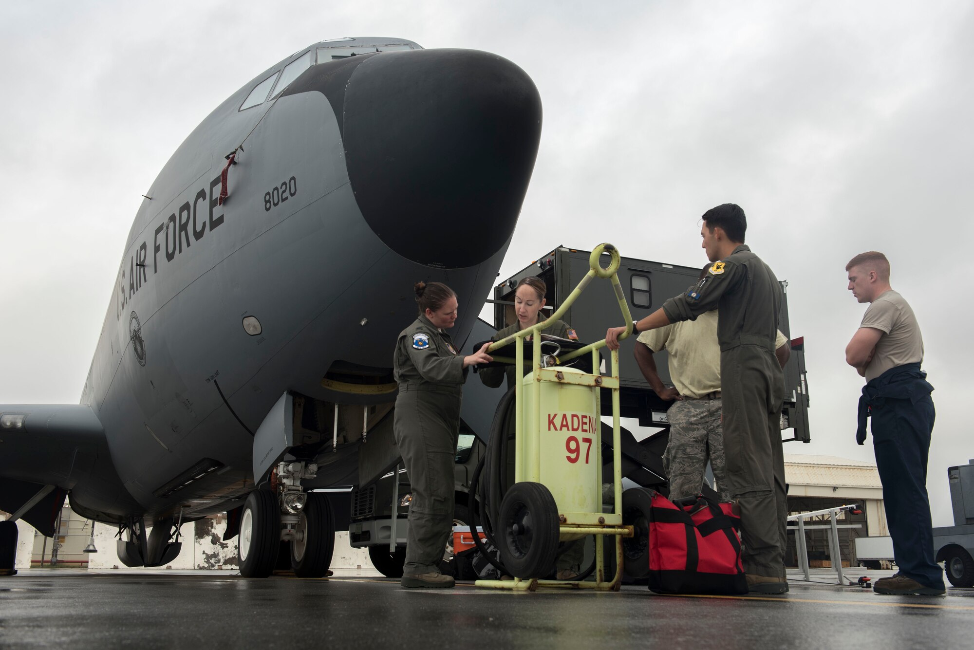 A 909th Air Refueling Squadron aircrew reviews pre-flight details before boarding a KC-135 Stratotanker May 3, 2017, at Kadena Air Base, Japan. Stratotankers have provided the core aerial refueling capability for the United States Air Force for more than 60 years. (U.S. Air Force photo by Senior Airman John Linzmeier)