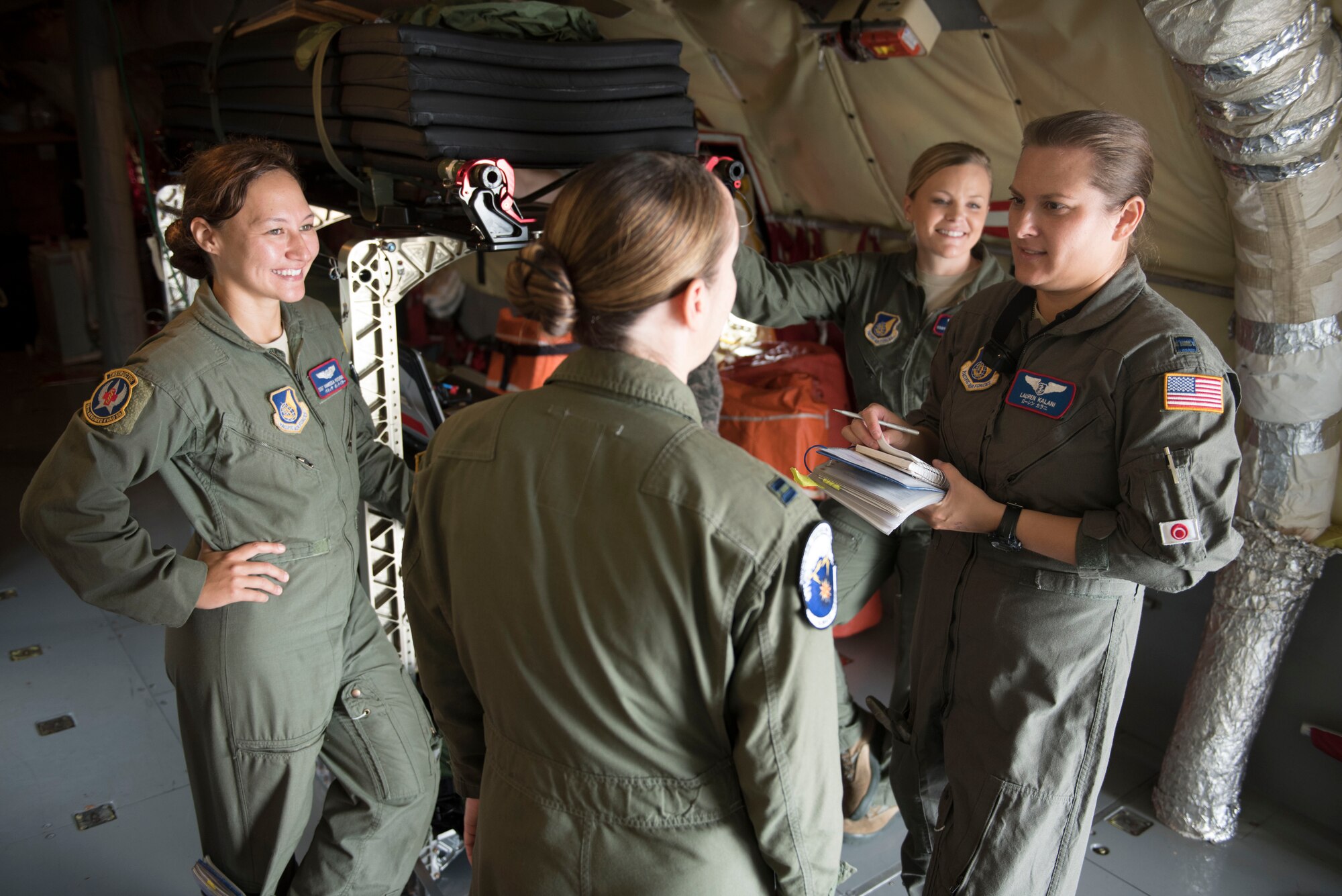 A medical team from the 18th Aeromedical Evacuation Squadron goes over mission details with a KC-135 Stratotanker pilot from the 909th Air Refueling Squadron May 3, 2017, at Kadena Air Base, Japan. Members of the 18th AES loaded medical supplies onboard in order to retrieve and care for patients from Yokota Air Base, Japan. (U.S. Air Force photo by Senior Airman John Linzmeier)