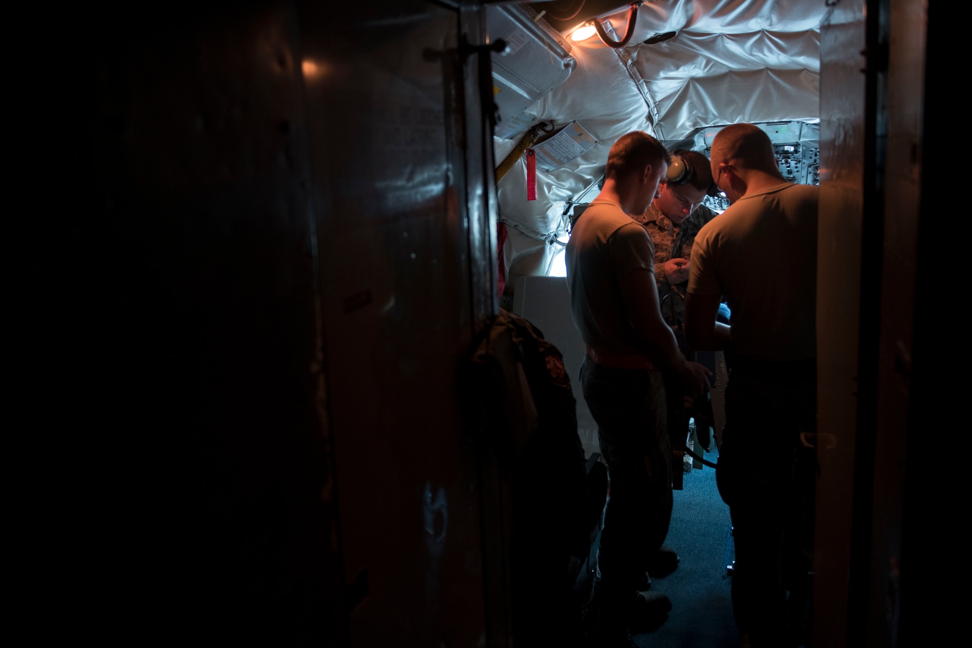 Maintenance Airmen from the 718th Aircraft Maintenance Squadron  go over a pre-flight checklist aboard a KC-135 Stratotanker from the 909th Air Refueling Squadron May 3, 2017, at Kadena Air Base, Japan. Maintainers work around the clock, ensuring the 909th ARS’ 15 Stratotankers are ready to deploy to worldwide destinations and to provide global reach for U.S. and allied aircraft. (U.S. Air Force photo by Senior Airman John Linzmeier)