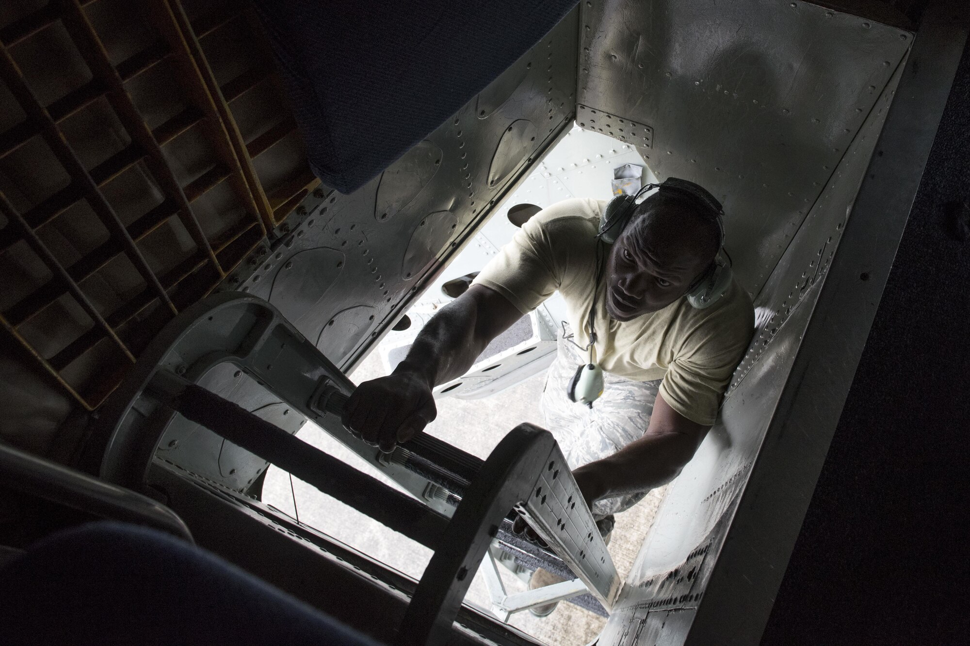 U.S. Air Force Staff Sgt. Gregory Smith, 718th Aircraft Maintenance Squadron dedicated crew chief, climbs onto a KC-135 Stratotanker May 3, 2017, at Kadena Air Base, Japan. As a dedicated crew chief, Smith travels with his assigned jet to provide upkeep and ensuring that it is ready to fly whenever the mission calls. (U.S. Air Force photo by Senior Airman John Linzmeier)