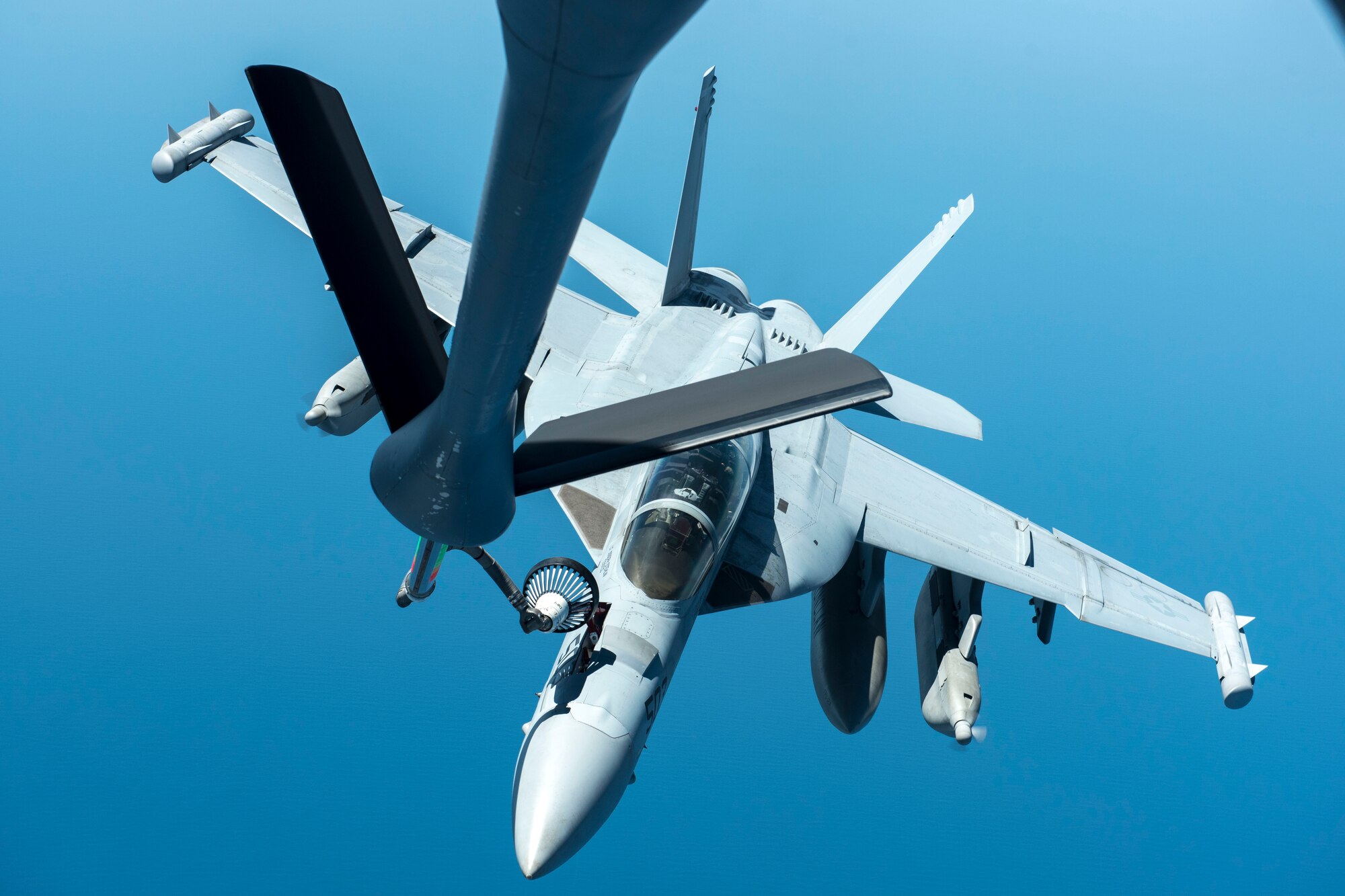 A U.S. Navy EA-18G Growler assigned to the USS Carl Vinson conducts in-air refueling with a U.S. Air Force KC-135 Stratotanker from the 909th Air Refueling Squadron May 3, 2017, over the Western Pacific Ocean. The 909th ARS’s motto is ‘Always There,’ symbolizing the squadron’s constant presence and devotion to support allies and partners throughout the Indo-Asia Pacific. (U.S. Air Force photo by Senior Airman John Linzmeier)