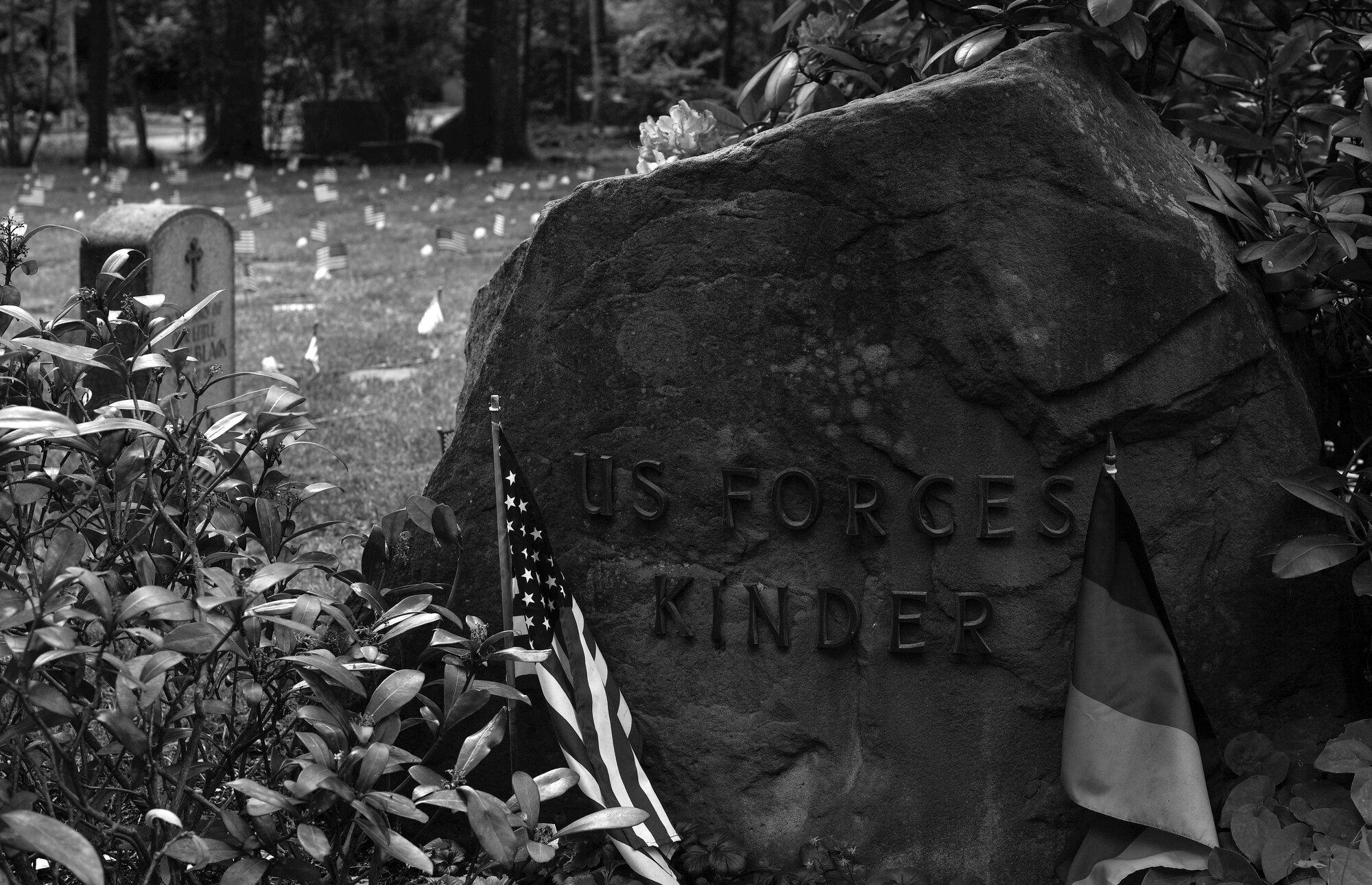 American flags and flowers adorn the gravestones of 452 American children laid to rest in the Kaiserslautern Kindergraves during the Ramstein Area Chief's Group and German-American and International Women's Club's Kindergraves Memorial Service in Kaiserslautern, Germany, May 20, 2017. The Kindergraves are the final resting place for 452 American children who died at or shortly after birth from 1952 to 1971. Every year after Mother’s Day, members of the Kaiserslautern Military Community honor their memory with a memorial service. (U.S. Air Force photo by Senior Airman Tryphena Mayhugh)