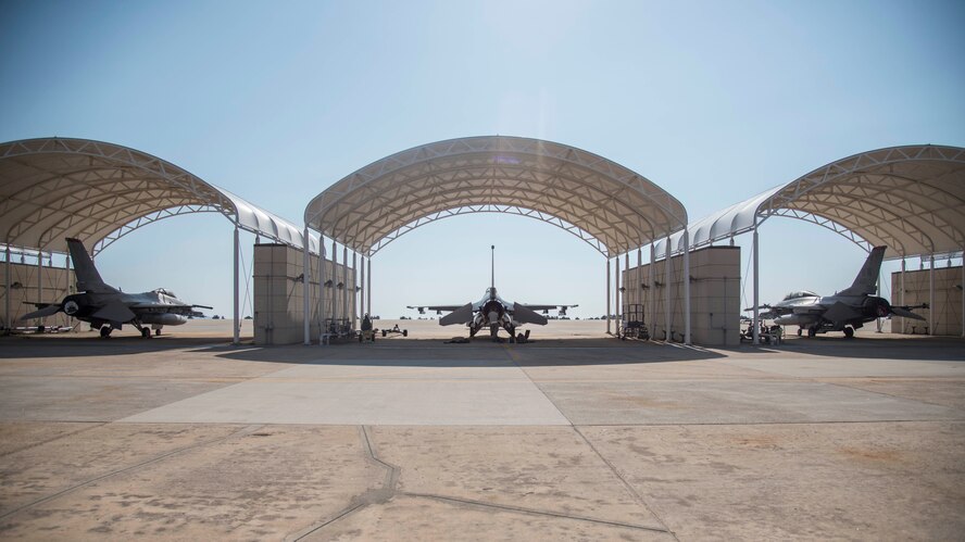 Three F-16 Fighting Falcons from Misawa Air Base, Japan sit under sunshades at Kunsan Air Base, Republic of Korea, May 19, 2017. While deployed to Kunsan, the 14th Fighter Squadron have flown joint offensive counter-air, defensive counter-air and suppression of enemy air defenses – the primary capability at Misawa AB. (U.S. Air Force photo by Senior Airman Brittany A. Chase)
