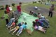 Children from Kadena Elementary School practice pushup as an educational activity May 22, 2017, at Kadena Air Base, Japan. Various educational booths were set up by the school’s English as a Second Language program to demonstrate a number of world records, such as the most pushups achieved within a 24-hour period, which is 46,001. (U.S. Air Force photo by Senior Airman John Linzmeier)