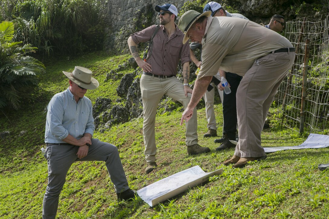 U.S. Marine Corps Lt. Gen. Lawrence D. Nicholson, III Marine Expeditionary Force commanding general, left, and David Leipold, a civilian contractor with the Information Management Office at III MEF, right, study a map during a Battle of Okinawa Tour on Okinawa, Japan, May 15, 2017. The battle tour was conducted to build a greater understanding of Marine Corps history on Okinawa through facilitated discussion and a guided tour, while building camaraderie and esprit de corps among the III MEF staff. (U.S. Marine Corps photo by MCIPAC Combat Camera Lance Cpl. Sean M. Evans)