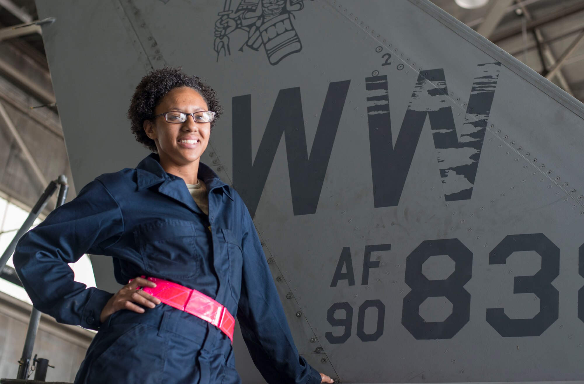 U.S. Air Force Senior Airman Janeill Hill, 35th Maintenance Squadron inspection section team member, poses for a photo at Kunsan Air Base, Republic of Korea, May 18, 2017. Hill is one of multiple Airmen who work in the phase shop that breaks down and inspects every inch of the aircraft, ensuring complete safety. (U.S. Air Force photo by Senior Airman Brittany A. Chase)