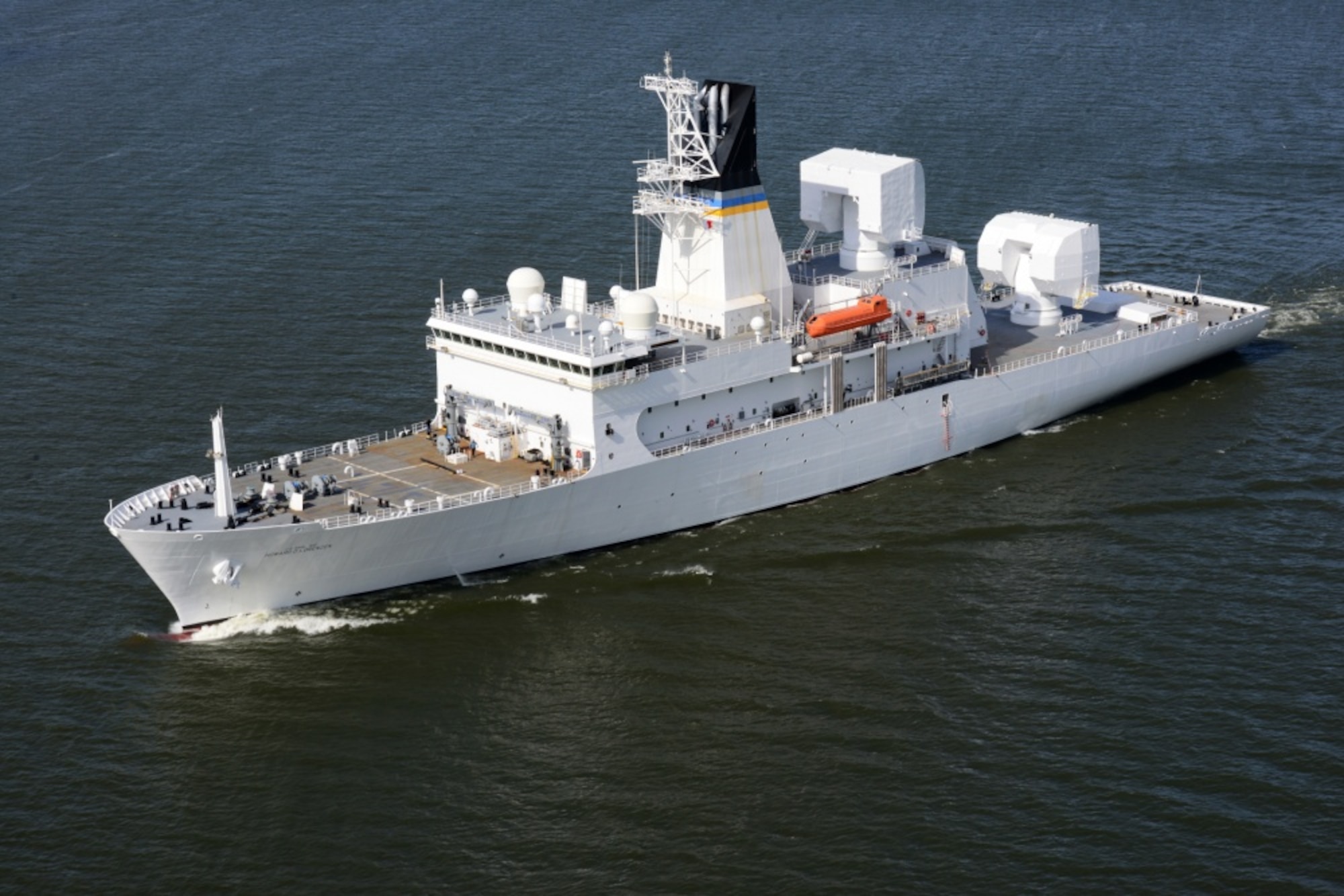 The USNS Howard O. Lorenzen (T-AGM-25) passes Astoria, Ore., as it departs the Columbia River into the Pacific Ocean, May 16, 2014. The USNS Howard O. Lorenzen is named for the late Naval Research Laboratory electrical engineer who was instrumental in the creation of the electronic intelligence capabilities of the United States. (U.S. Coast Guard photo by Petty Officer 1st Class David Mosley)