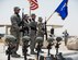 U.S. Air Force airmen with the Al Udeid Air Base honor guard presents the Colors for the final guardmount ceremony at Al Udeid Air Base, Qatar, May 19, 2017. The final guardmount ceremony is a tradition where all members of 379th Expeditionary Security Forces Squadron pay tribute to fallen Security Forces Airmen and U.S. Air Force Office of Special Investigations agents who have died in the line of duty by calling out their names as the flight sergeant conducts roll call. (U.S. Air Force photo by Tech. Sgt. Amy M. Lovgren)