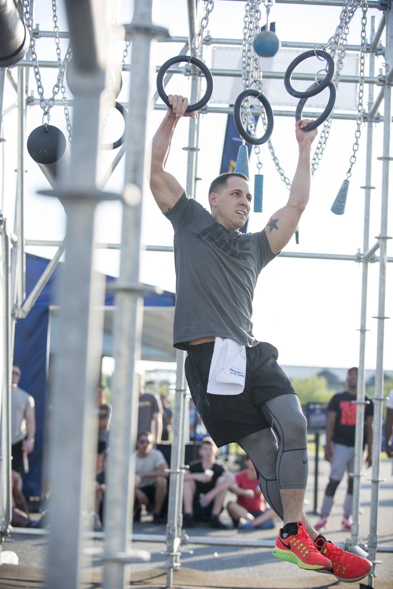 Tech Sgt. Chad Hardesty, 436th Force Support Squadron airmen leadership school instructor, maneuvers through the ring obstacle during the Alpha Warrior battle station competition May 17, 2017, on Dover Air Force Base, Del. Hardesty finished the rig with a time of 2:44 and was one of five to do so. (U.S. Air Force photo by Staff Sgt. Jared Duhon)