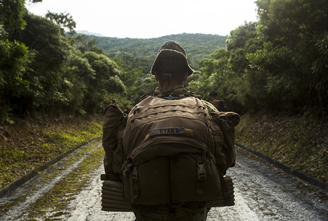 Cpl. Patrick Ryan conducts a patrol at Jungle Warfare Training Center, Camp Gonzalves, Okinawa, Japan, May 17, 2017. The unit patrolled through the woods, conducted medical evacuations and assaulted enemy villages during their 12-day training iteration. This training prepares them for their upcoming deployment to Thailand and the Philippines in support of the Cooperation Afloat Readiness and Training multilateral exercise. Ryan, a native of Falmouth, Massachusetts, is a squad leader for Company K, 3rd Battalion, 8th Marine Regiment and is assigned to 3rd Marine Division, III Marine Expeditionary Force, through the unit deployment program. (U.S. Marine Corps photo by Lance Cpl. Joshua Pinkney)
