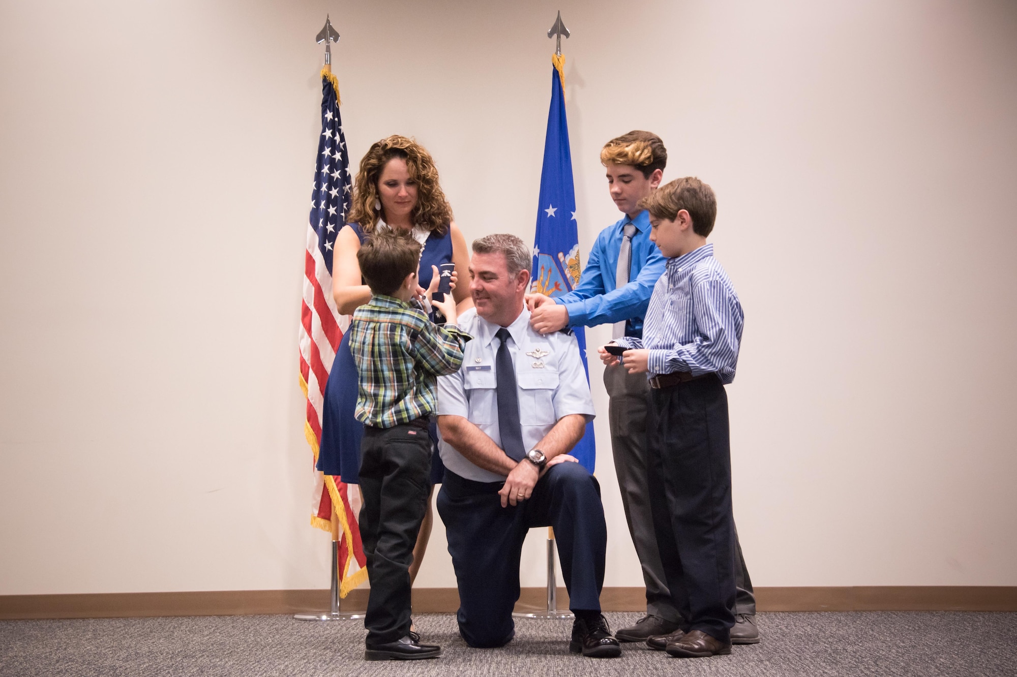 Col. Brian May, 403rd Operations Group commander, has colonel rank pinned on by his wife Kathy and their sons Giovanni, Darrio and Cameron during his promotion ceremony March 4, 2017 at Keesler Air Force Base, Mississippi. (U.S. Air Force photo/Staff Sgt. Heather Heiney)