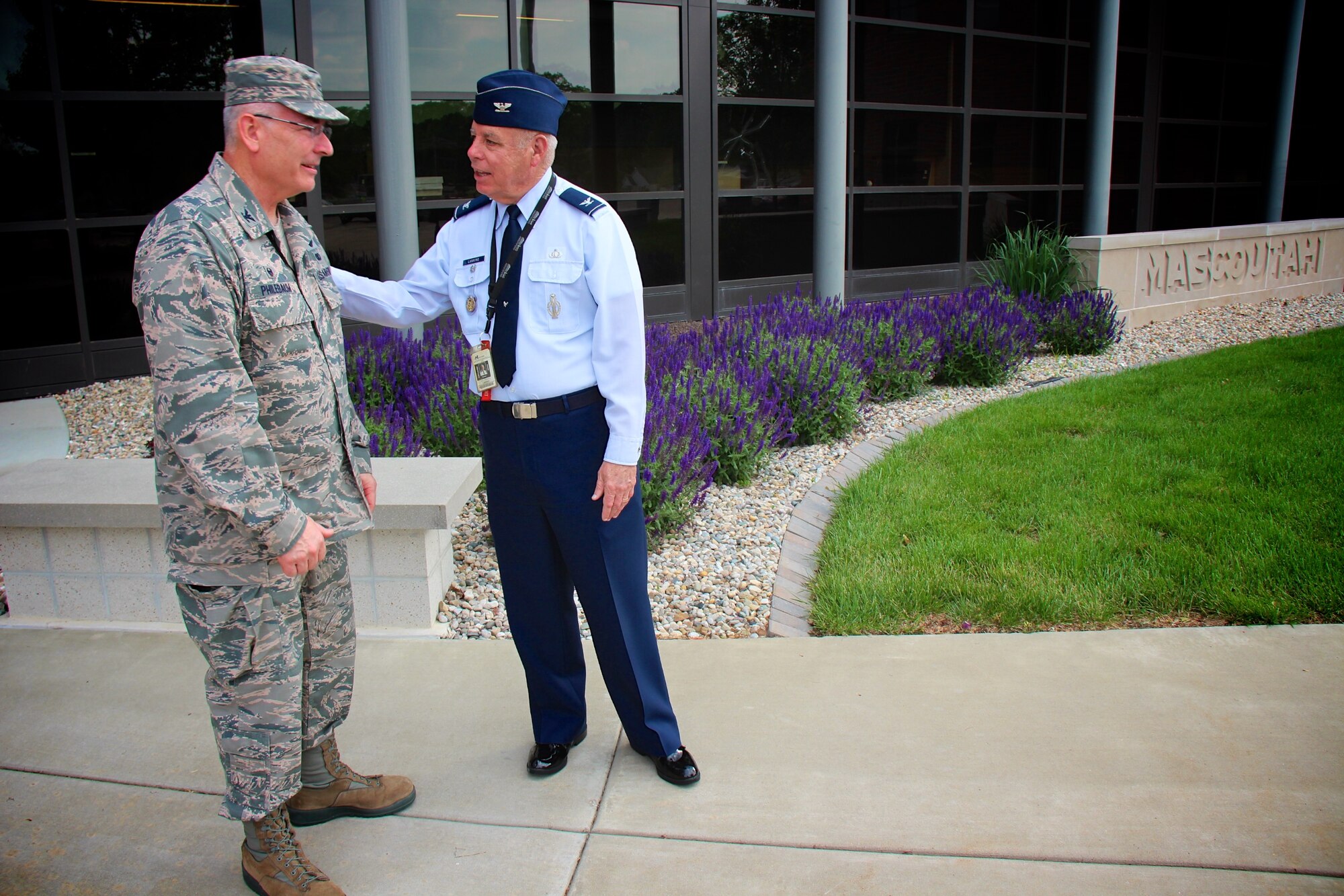 Commander of the 932nd Airlift Wing, Col. Jonathan Philebaum, shares a moment of reflection and appreciation with Col. Randall Lanning, commander and instructor at the Mascoutah High School Air Force Junior Reserve Officer Training Corps.  Both colonels are retiring in the next couple of weeks.  Col. Philebaum retires on June 3, and he spoke to the high school students about his career, overcoming adversity, and service to others and the Air Force during an early morning visit, as part of their roll call JROTC meeting. Col. Lanning is retiring this month as the Senior Aerospace Science Instructor for the group of cadets near Scott Air Force Base, and he has worked continuously with many projects involving both units. The 932nd AW formally "adopted" the Mascoutah detachment in April, 2010. This visit on May 10, 2017, marked the final joint outreach project between the two commanders.  (U.S. Air Force photo by Lt. Col. Stan Paregien)