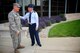 Commander of the 932nd Airlift Wing, Col. Jonathan Philebaum, shares a moment of reflection and appreciation with Col. Randall Lanning, commander and instructor at the Mascoutah High School Air Force Junior Reserve Officer Training Corps.  Both colonels are retiring in the next couple of weeks.  Col. Philebaum retires on June 3, and he spoke to the high school students about his career, overcoming adversity, and service to others and the Air Force during an early morning visit, as part of their roll call JROTC meeting. Col. Lanning is retiring this month as the Senior Aerospace Science Instructor for the group of cadets near Scott Air Force Base, and he has worked continuously with many projects involving both units. The 932nd AW formally 
