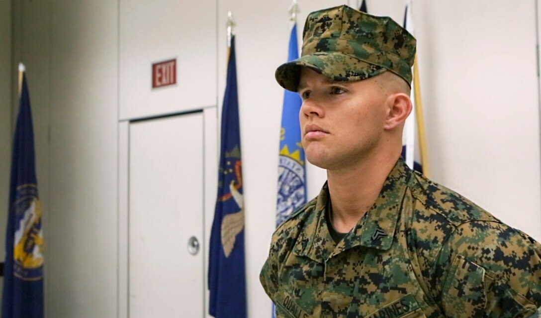 Cpl. David Qualls, a motor transport assistant operations chief with Marine Wing Support Squadron 471, 4th Marine Aircraft Wing, Marine Forces Reserve, stands at parade rest while he waits to be awarded the Navy and Marine Corps Medal at the 1st Battalion, 23rd Marine Regiment headquarters in Houston, Texas, May 20, 2017. In 2014, helped save a man stuck inside a burning vehicle. According to Qualls’ award summary, had he not arrived when he did, the man would have surely died. (U.S. Marine Corps photo by Cpl. Dallas Johnson)