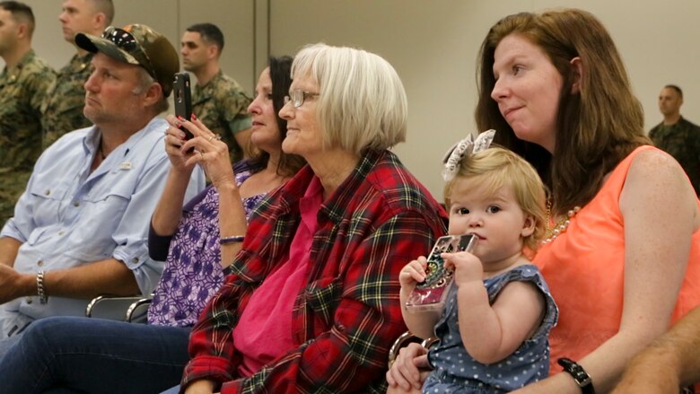The family of Cpl. David Qualls, a motor transport assistant operations chief with Marine Wing Support Squadron 471, 4th Marine Aircraft Wing, Marine Forces Reserve, listen attentively as Qualls receives his Navy and Marine Corps Medal at the 1st Battalion, 23rd Marine Regiment headquarters in Houston, Texas, May 20, 2017. In 2014, Qualls and other Marines helped save a man stuck inside a burning vehicle. According to the award summary, had he not arrived when he did, the man would have surely died. (U.S. Marine Corps photo by Cpl. Dallas Johnson)