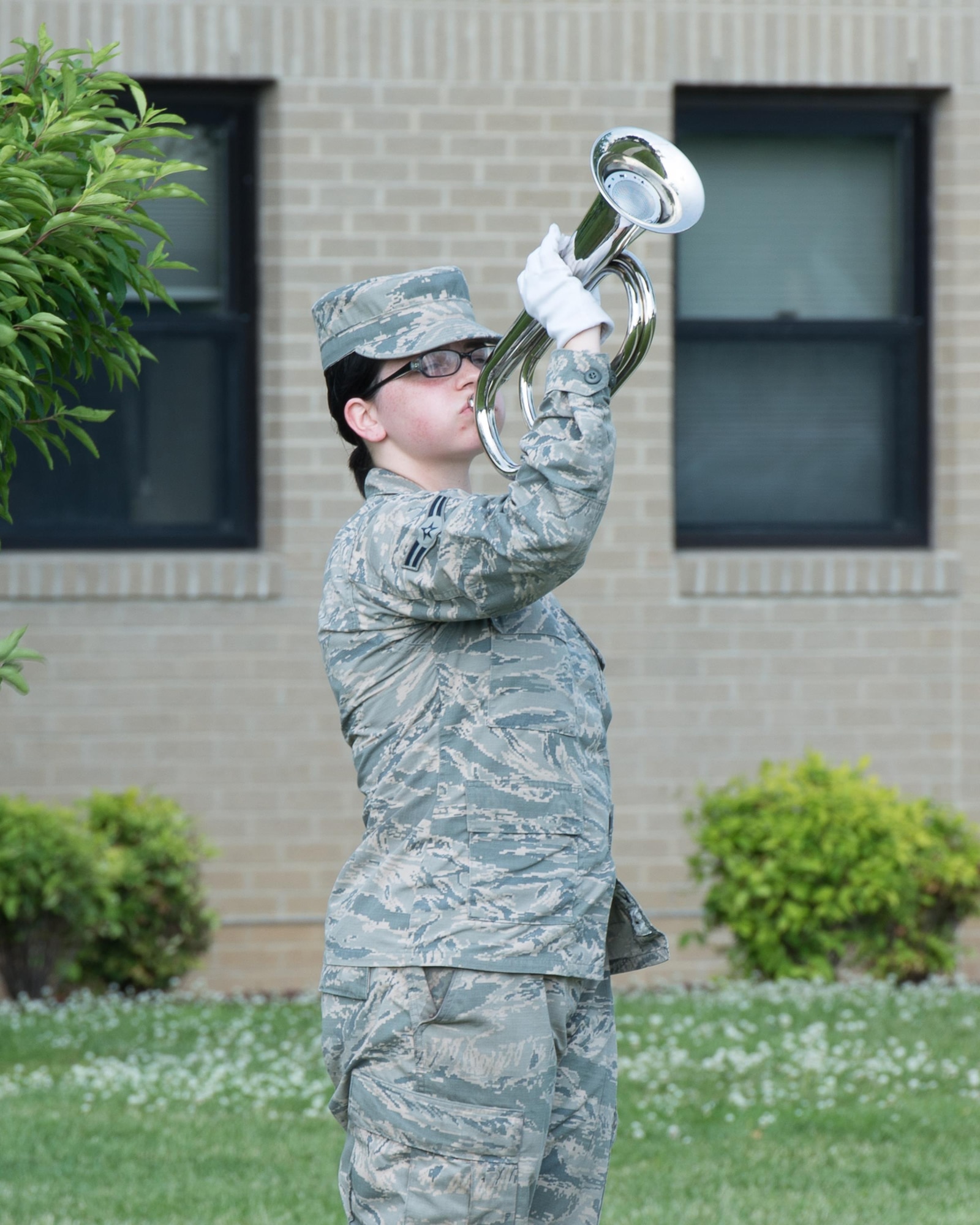 Airman 1st Class Mellissa Adams, 436th Logistics Readiness Squadron fuels distribution operator, plays Taps during a retreat ceremony May 19, 2016 at Dover Air Force Base, Del. Adams is currently attached to the base honor guard. (U.S. Air Force photo by Mauricio Campino)