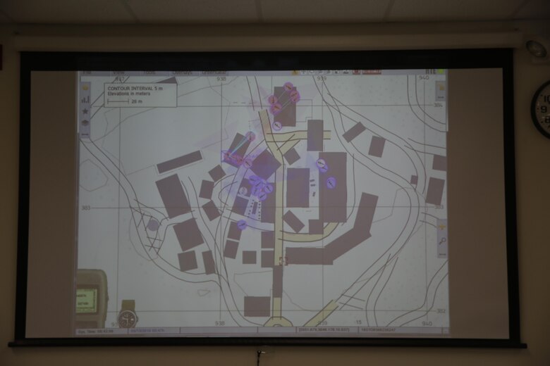 A Map of the simulated area of operations is displayed during a Spartan Tactical Games competition at Camp Lejeune, N.C., May 17, 2017. The Marines participated in a squad versus squad virtual training exercise to improve their tactics and maneuvers in a controlled environment. The Marines are with 2nd Battalion, 6th Marine Regiment. (U.S. Marine Photo by Lance Cpl Leynard Kyle Plazo)