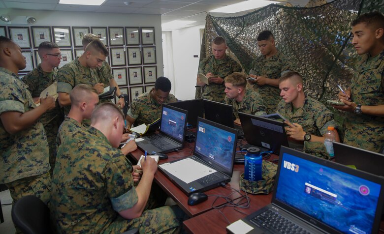 Marines formulate a plan before participating in a game during a Spartan Tactical Games competition at Camp Lejeune, N.C., May 17, 2017. The Marines participated in a squad versus squad virtual training exercise to improve their tactics and maneuvers in a controlled environment. The Marines are with 2nd Battalion, 6th Marine Regiment. (U.S. Marine Photo by Lance Cpl Leynard Kyle Plazo)