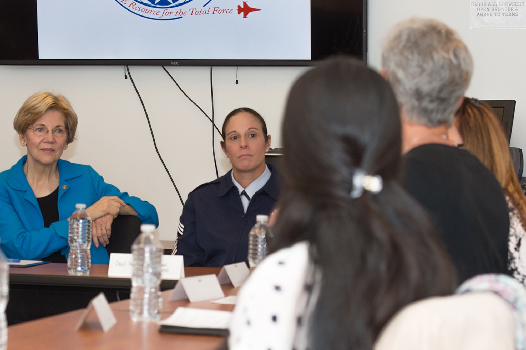 U.S. Senator Elizabeth Warren talks with staff members and military spouses at Hanscom AFB, Mass., at a roundtable forum in the Airman and Family Readiness Center May 22. Warren also received base and mission overviews and toured the Hanscom Collaboration and Innovation Center while on base. (U.S. Air Force photo by Jerry Saslav)