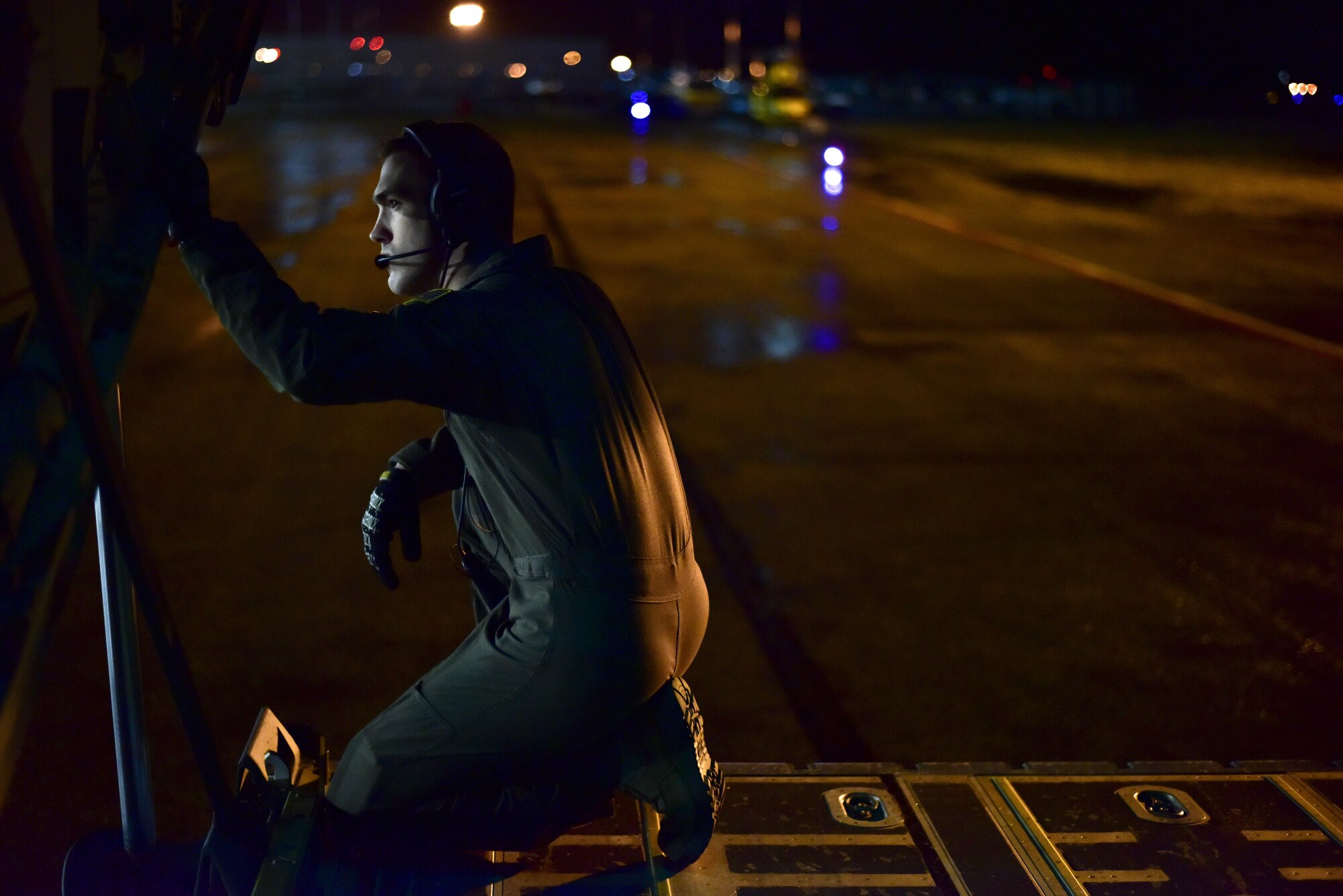 U.S. Air Force Airman 1st Class Tyler Wilson, 41st Airlift Squadron Loadmaster, watches for wing distance safety as the C-130J taxied into position to load Canadian light infantry April 22, 2017 in Alberta, Canada. The 41st Airlift Squadron participated in Canadian exercise Fanatic Pegasus with Royal Canadian air forces and this is the first time American forces have participated in this exercise which establishes air and ground forces in unfamiliar terrain to work on communication and rapid deployment of those resources.  
(U.S. Air Force photo by Staff Sgt. Jeremy McGuffin)