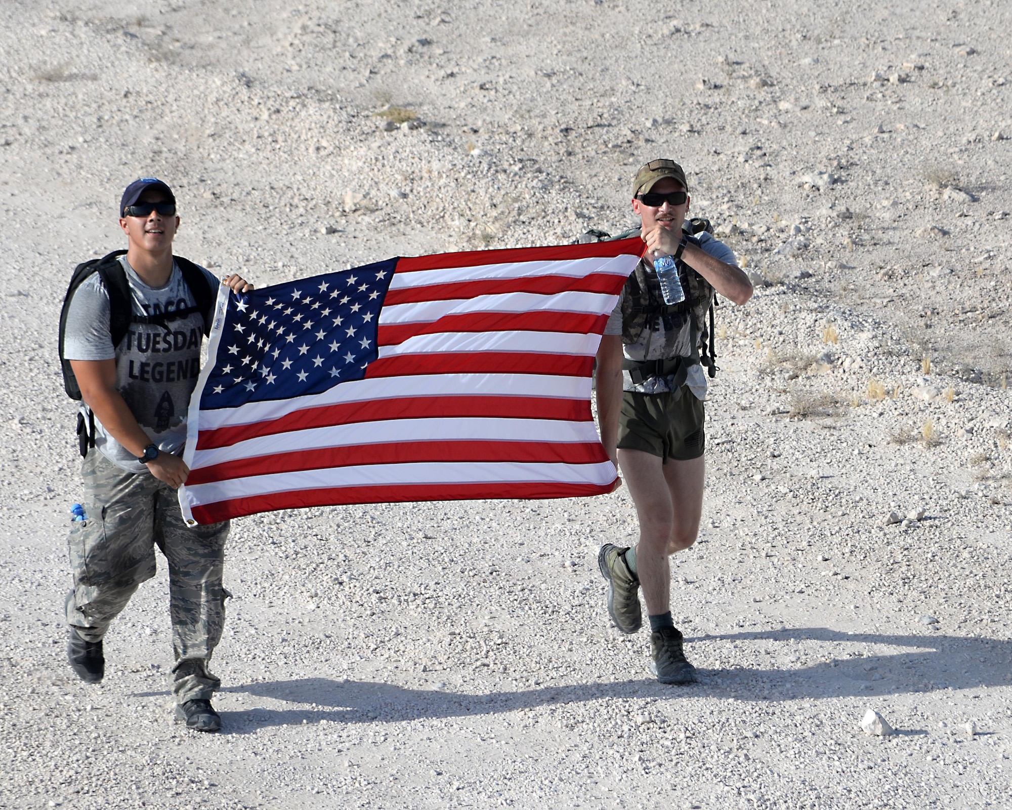 Members from the U.S. Air Force take part in an early morning ruck march on day two of police week at Al Udeid Air Base, Qatar May 16, 2017. Airmen from the 379th ESFS organized a week of law enforcement activities to honor fallen civilian police officers, security forces airmen and U.S. Air Force Office of Special Investigations agents who died in the line of duty. (U.S. Air Force photo by Tech. Sgt. Bradly A. Schneider)