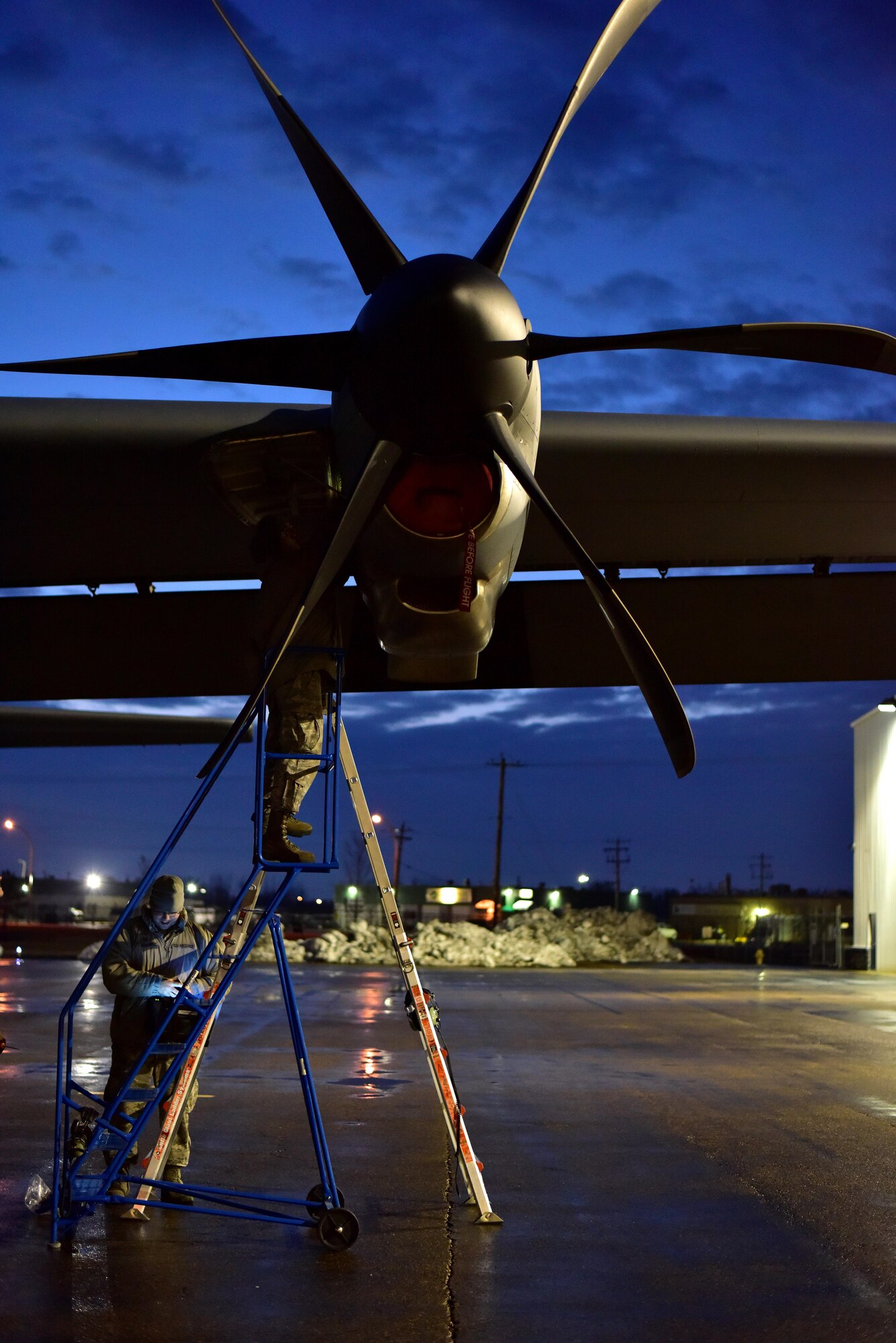 U.S. Air Force Staff Sgt. William Eales, 19th Aircraft Maintenance Squadron, inspects a C-130J engine as Tech. Sgt. Sam Bishop, 19th AMXS, checks the technical orders after error codes showed a malfunction April 22, 2017 in Alberta, Canada. The 41st Airlift Squadron participated in Canadian exercise Fanatic Pegasus with Royal Canadian air forces and this is the first time American forces have participated in this exercise which establishes air and ground forces in unfamiliar terrain to work on communication and rapid deployment of those resources.  (U.S. Air Force photo by Staff Sgt. Jeremy McGuffin)