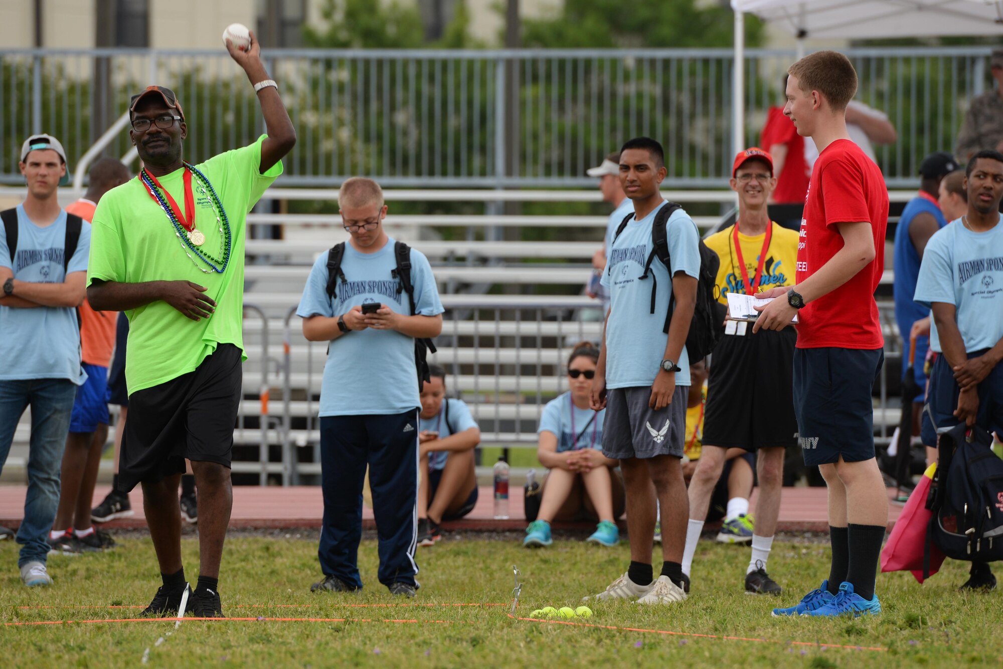 A Special Olympics athlete winds up a throw at a softball throw competition during the SOMS 2017 Summer Games at the Triangle Track, May 20, 2017, on Keesler Air Force Base, Miss. Founded in 1968, Special Olympics hosts sporting events around the world for people of all ages with special needs, to include more than 700 athletes from Mississippi. (U.S. Air Force photo by Senior Airman Duncan McElroy)