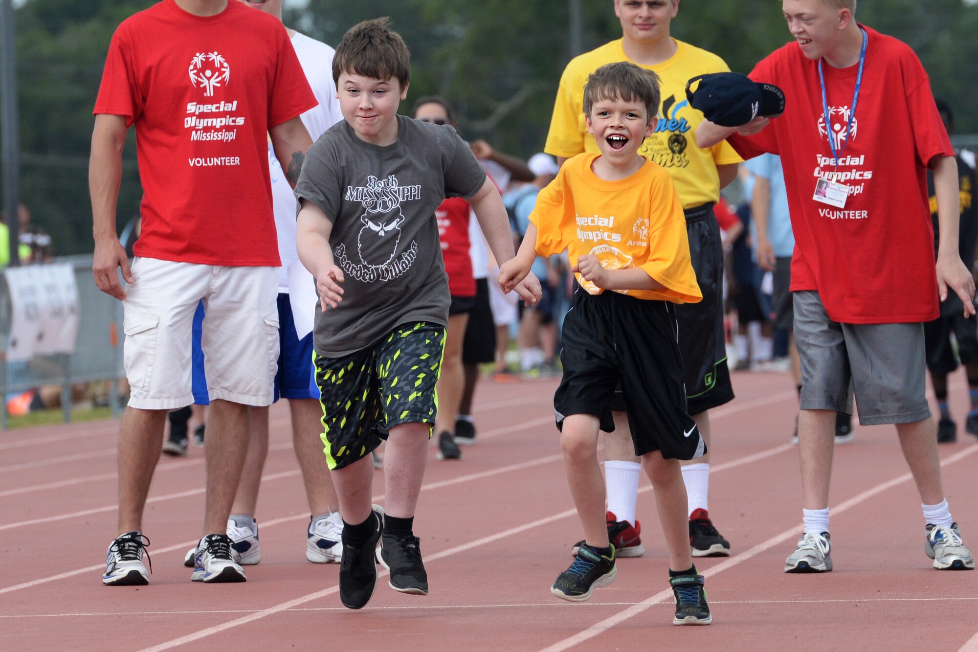 Korban Ossary, Area 11 athlete, and Malachy Harrison, Area 3 athlete, run the 50 meter dash during the Special Olympics Mississippi 2017 Summer Games at the Triangle Track May 20, 2017, on Keesler Air Force Base, Miss. Founded in 1968, Special Olympics hosts sporting events around the world for people of all ages with special needs to include more than 700 athletes from Mississippi. (U.S. Air Force photo by Airman 1st Class Travis Beihl)