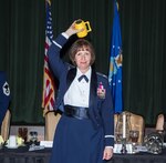 Colonel Michelle Hayworth, 688th Cyberspace Wing commander, participates in the tradition of "Skulling In" during a Dining Out celebrating the 92nd Cyberspace Operations Squadron's 75th anniversary May 12, 2017, at Joint Base San Antonio-Lackland. The tradition derives from the 92nd COS motto, "Once A Skull, Always A Skull".