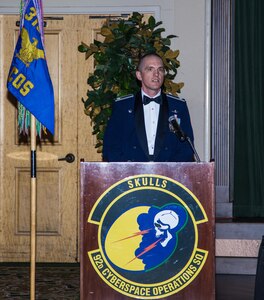 Lieutenant Col. Benjamin Montgomery, 92nd Cyberspace Operations Squadron commander, addresses the members of the mess during the 92nd COS 75th Anniversary Dining Out May 12, 2017, at Joint Base San Antonio-Lackland. Montgomery highlighted the squadron's many accomplishments dating back 75 years and how the squadron is carrying on traditions from combat in the air to combating adversaries in cyberspace.