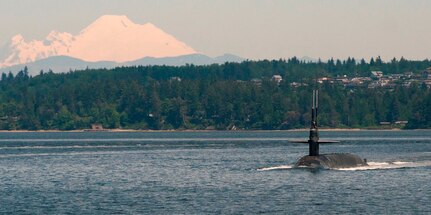 The Ohio-class ballistic-missile submarine USS Louisiana (SSBN 743) transits the Hood Canal May 22, 2017, as it returns to its homeport following a strategic deterrent patrol. Louisiana is one of eight ballistic-missile submarines stationed at Naval Base Kitsap-Bangor providing the most survivable leg of the strategic deterrence triad for the United States. (U.S. Navy photo by Lt. Cmdr. Michael Smith/Released)