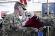 Command Sgt. Maj. Daryl Forsythe, the command sergeant major for the 86th Combat Support Hospital, reveals the unit’s colors, during the transfer of authority ceremony, in the Zone 1 Fitness Center, Camp Arifjan, Kuwait, May 5. The ceremony transfers the authority of the United States Military Hospital- Kuwait from the 31st CSH to the 86th CSH. (U.S. Army photo by Sgt. Bethany Huff, ARCENT Public Affairs)