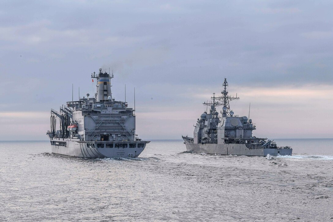 The Ticonderoga-class guided-missile cruiser USS Lake Champlain pulls alongside Henry J. Kaiser-class underway replenishment oiler USNS Rappahannock to receive fuel during a replenishment-at-sea in the western Pacific Ocean, May 13, 2017. Lake Champlain is on a regularly scheduled western Pacific deployment with the Carl Vinson Carrier Strike Group. Navy photo by Petty Officer 3rd Class Kelsey L. Adams