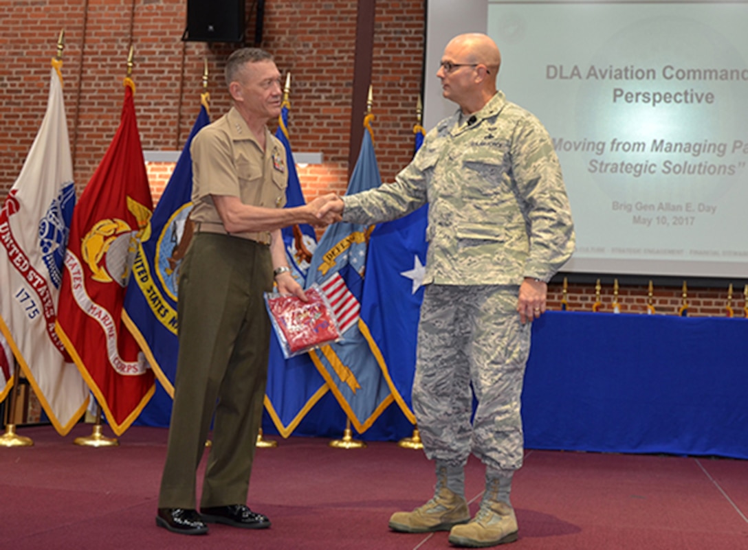 Defense Logistics Agency Aviation Commander Air Force Brig. Gen. Allan Day thanks Aviation’s Marine Corps Deputy Commandant for Aviation Lt. Gen. Jon Davis as guest speaker during the Senior Executive Partnership Roundtable held May 10, 2017 at the Frank B. Lotts Conference Center on Defense Supply Center Richmond, Virginia. Davis spoke from a customers’ perspective to senior executives from strategic supplier alliances, DLA Aviation leadership, and military customer senior leaders.