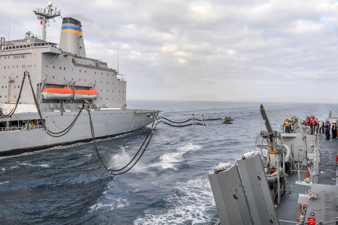The Henry J. Kaiser-class underway replenishment oiler USNS Rappahannock sends a fuel probe to Arleigh Burke-class guided-missile destroyer USS Wayne E. Meyer during a replenishment-at-sea in the western Pacific Ocean, May 13, 2017. Navy photo by Petty Officer 3rd Class Kelsey L. Adams