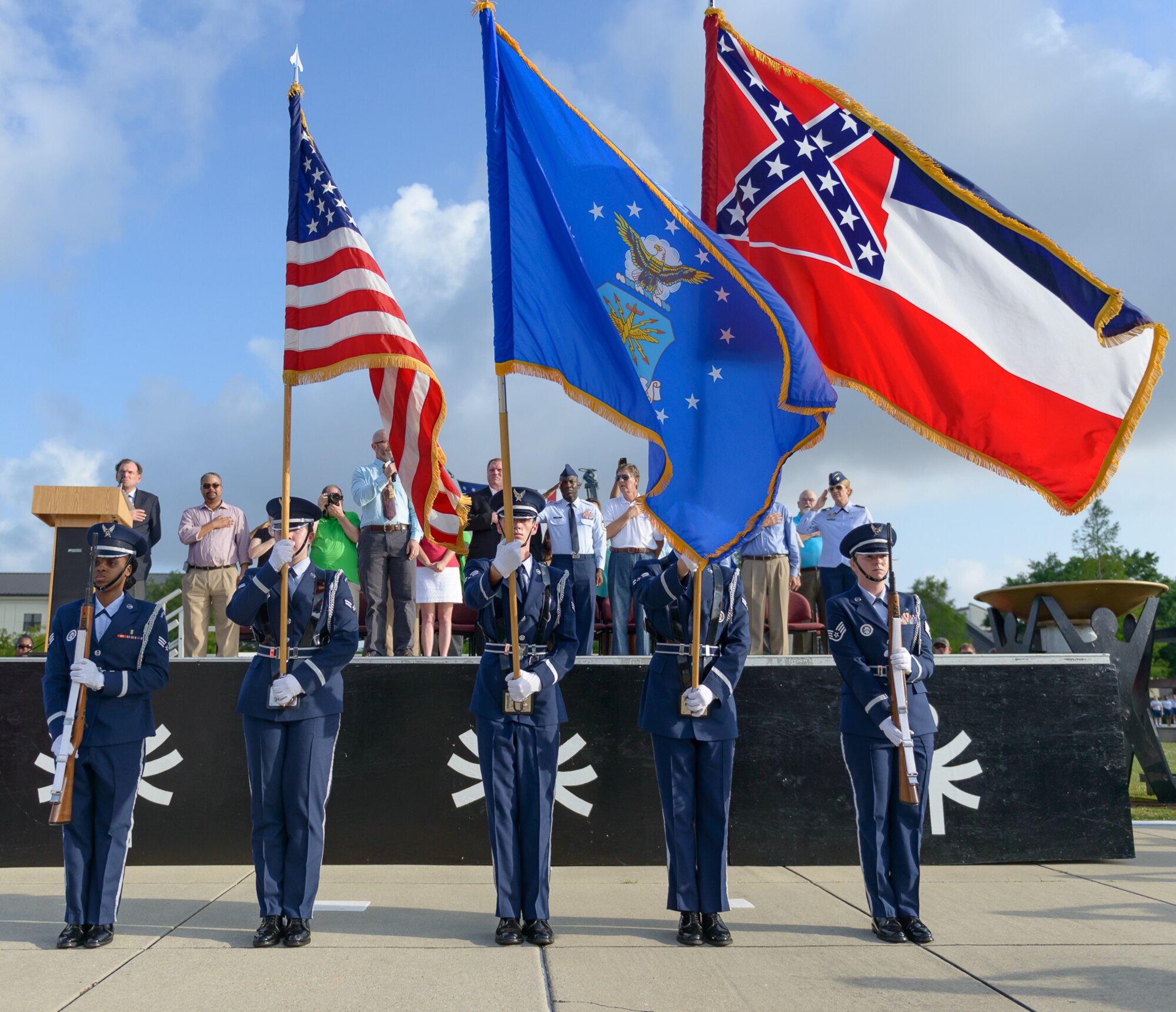 Keesler Honor Guard members present the colors during the Special Olympics Mississippi 2017 Summer Games opening ceremonies at the Levitow Training Support Facility drill pad May 20, 2017, on Keesler Air Force Base, Miss. Founded in 1968, Special Olympics hosts sporting events around the world for people of all ages with special needs to include more than 700 athletes from Mississippi. (U.S. Air Force photo by Andre’ Askew)