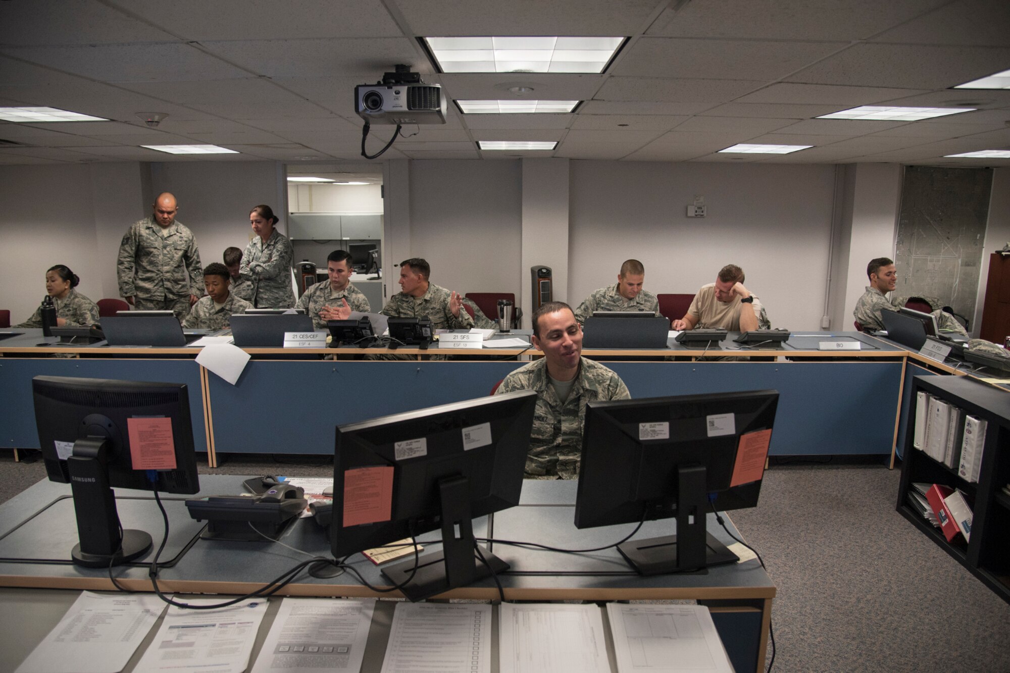 PETERSON AIR FORCE BASE, Colo. – Airmen with the 21st Civil Engineer Squadron develop a logistics plan for a beddown exercise for their monthly Prime Base Engineer Emergency Force day, May 18, 2017, at Peterson Air Force Base, Colo. Approximately 100 21st CES Airmen participated in Prime BEEF day, completing a beddown exercise for a scenario involving 2500 troops, 23 aircraft and operational space assets. (U.S. Air Force photo by Staff Sgt. Tiffany Lundberg)