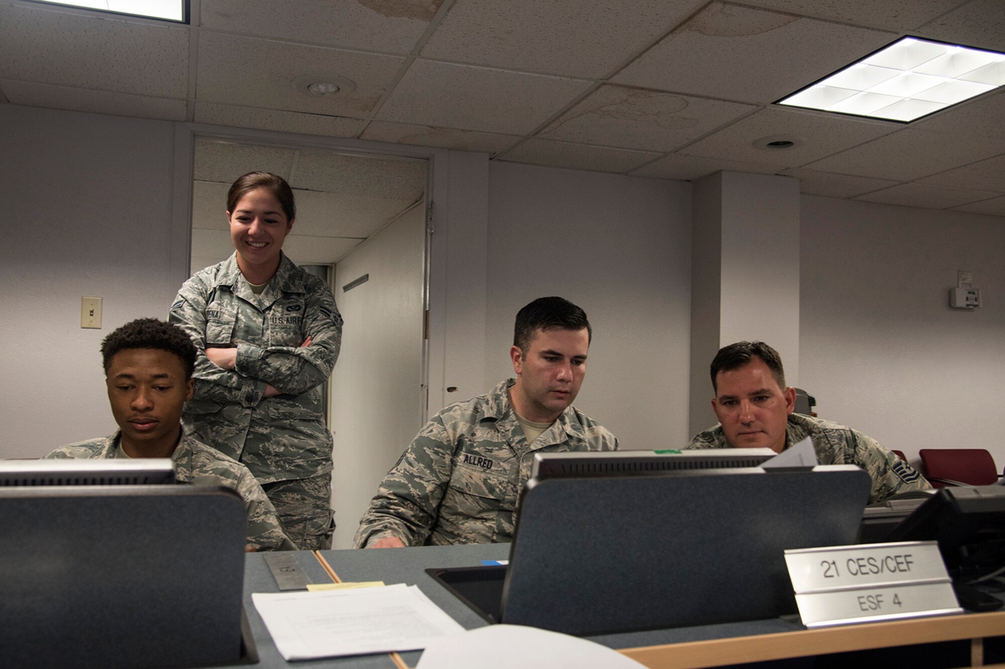 PETERSON AIR FORCE BASE, Colo. – Airmen with the 21st Civil Engineer Squadron develop a logistics plan and review Air Force Instruction requirements for a beddown exercise during their monthly Prime Base Engineer Emergency Force day, May 18, 2017, at Peterson Air Force Base, Colo. Approximately 100 21st CES Airmen participated in Prime BEEF day, completing a beddown exercise for a scenario involving 2500 troops, 23 aircraft and operational space assets. The squadron was split up into two teams for the day: planning group and hands-on training. (U.S. Air Force photo by Staff Sgt. Tiffany Lundberg)