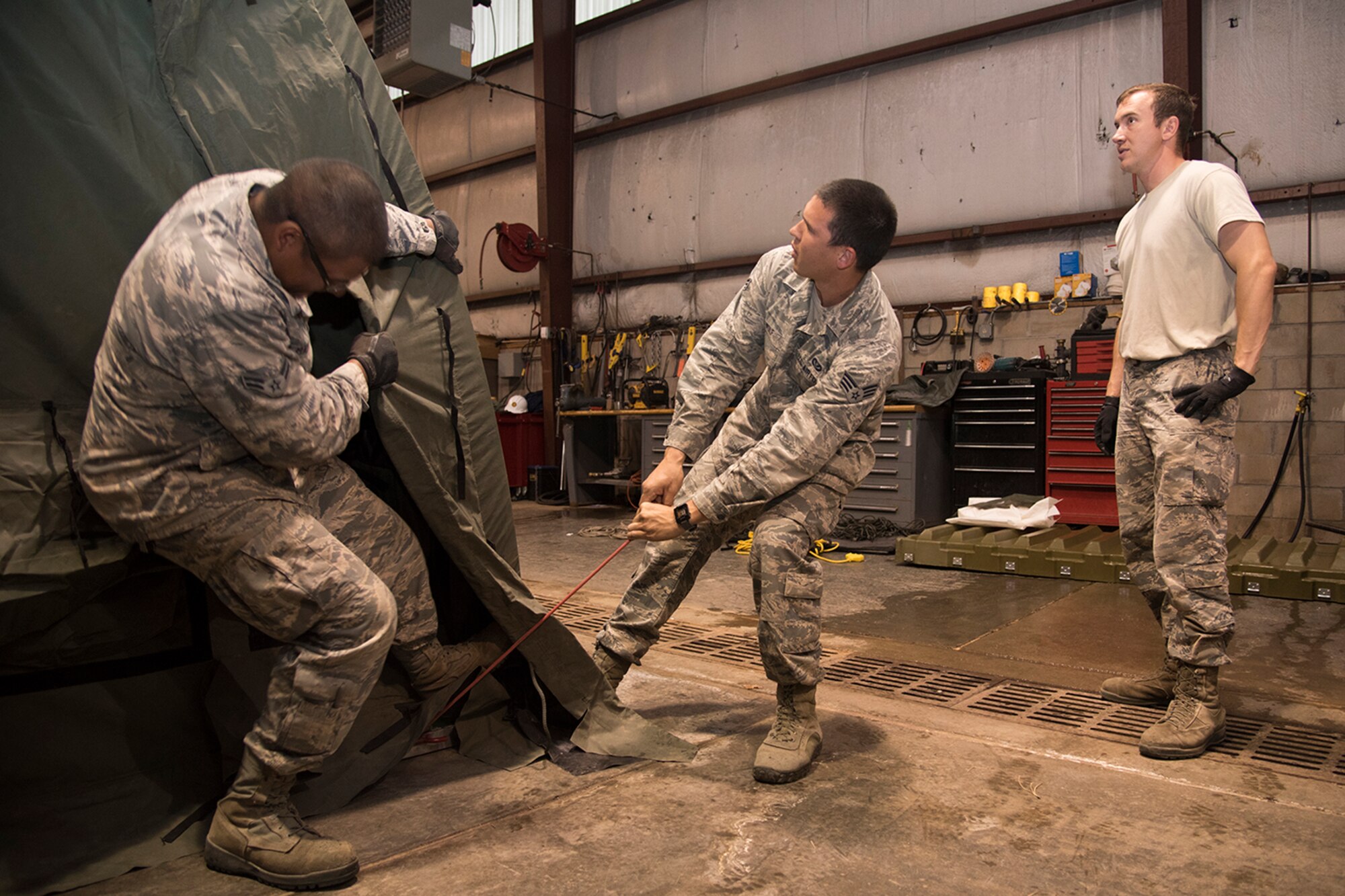 PETERSON AIR FORCE BASE, Colo. – Airmen with the 21st Civil Engineer Squadron set up a tent for the hands-on portion of a beddown exercise during their monthly Prime Base Engineer Emergency Force day, May 18, 2017, at Peterson Air Force Base, Colo. Approximately 100 21st CES Airmen participated in Prime BEEF day, completing a beddown exercise for a scenario involving 2500 troops, 23 aircraft and operational space assets. (U.S. Air Force photo by Staff Sgt. Tiffany Lundberg)