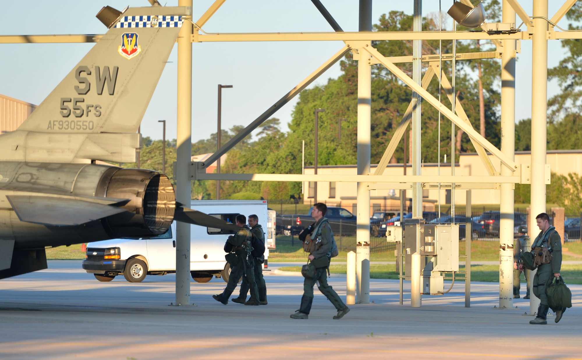 U.S. Air Force pilots assigned to the 55th Fighter Squadron walk toward F-16CM Fighting Falcons during operational readiness exercise (ORE) Weasel Victory 17-07 at Shaw Air Force Base, S.C., May 15, 2017. Throughout the ORE pilots also wore protective gear to include web belts and Kevlar helmets.  (U.S. Air Force photo by Airman 1st Class Christopher Maldonado)