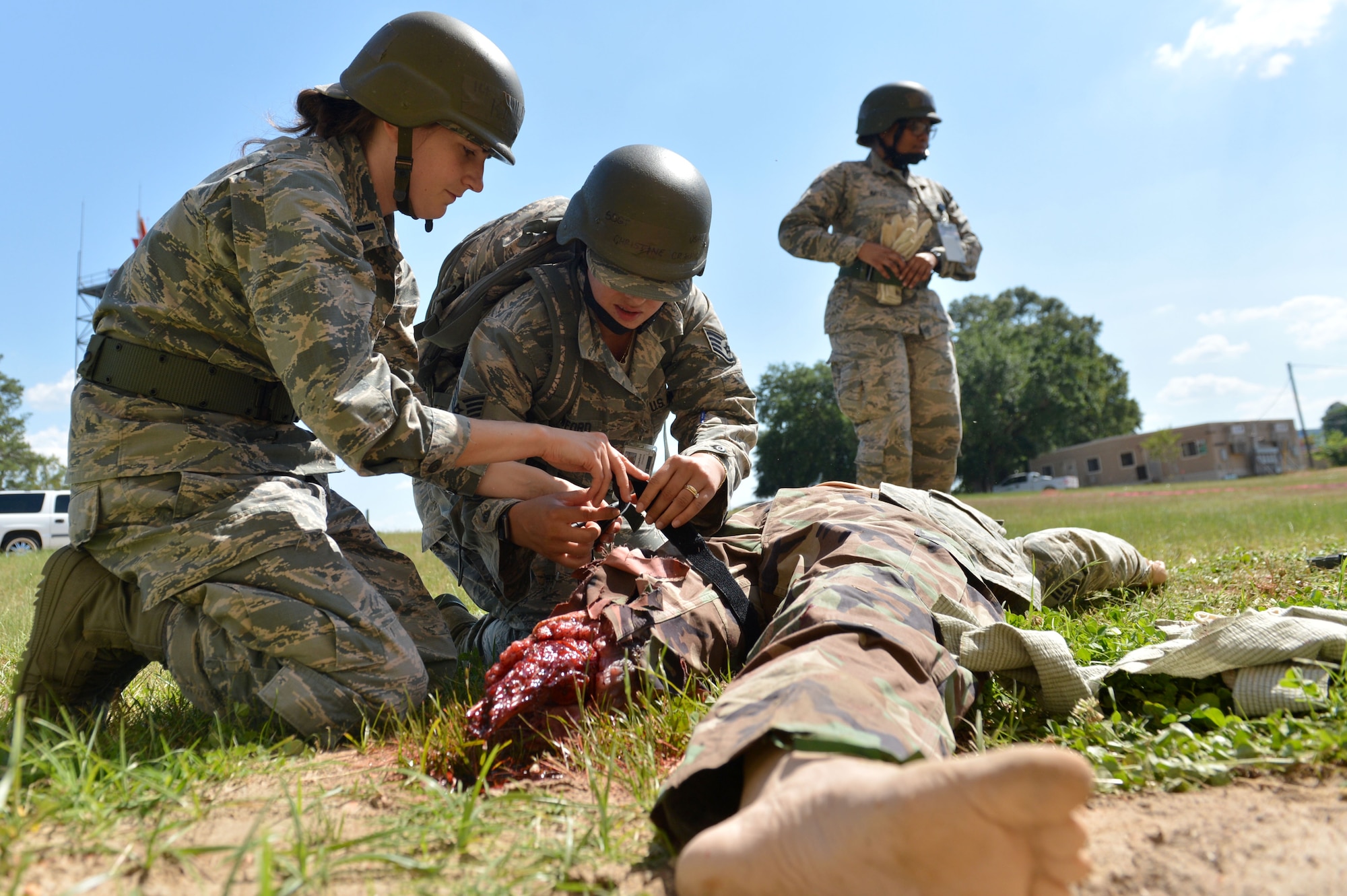 U.S. Airmen assigned to the 20th Medical Operations Support Squadron (MDOS) tend to a dummy patient during operational readiness exercise Weasel Victory 17-07 at Shaw Air Force Base, S.C., May 16, 2017. Airmen assigned to the 20th MDOS were tested on how quickly and efficiently they could care for injured casualties in a deployed or stateside environment. (U.S. Air Force photo by Airman 1st Class Christopher Maldonado)