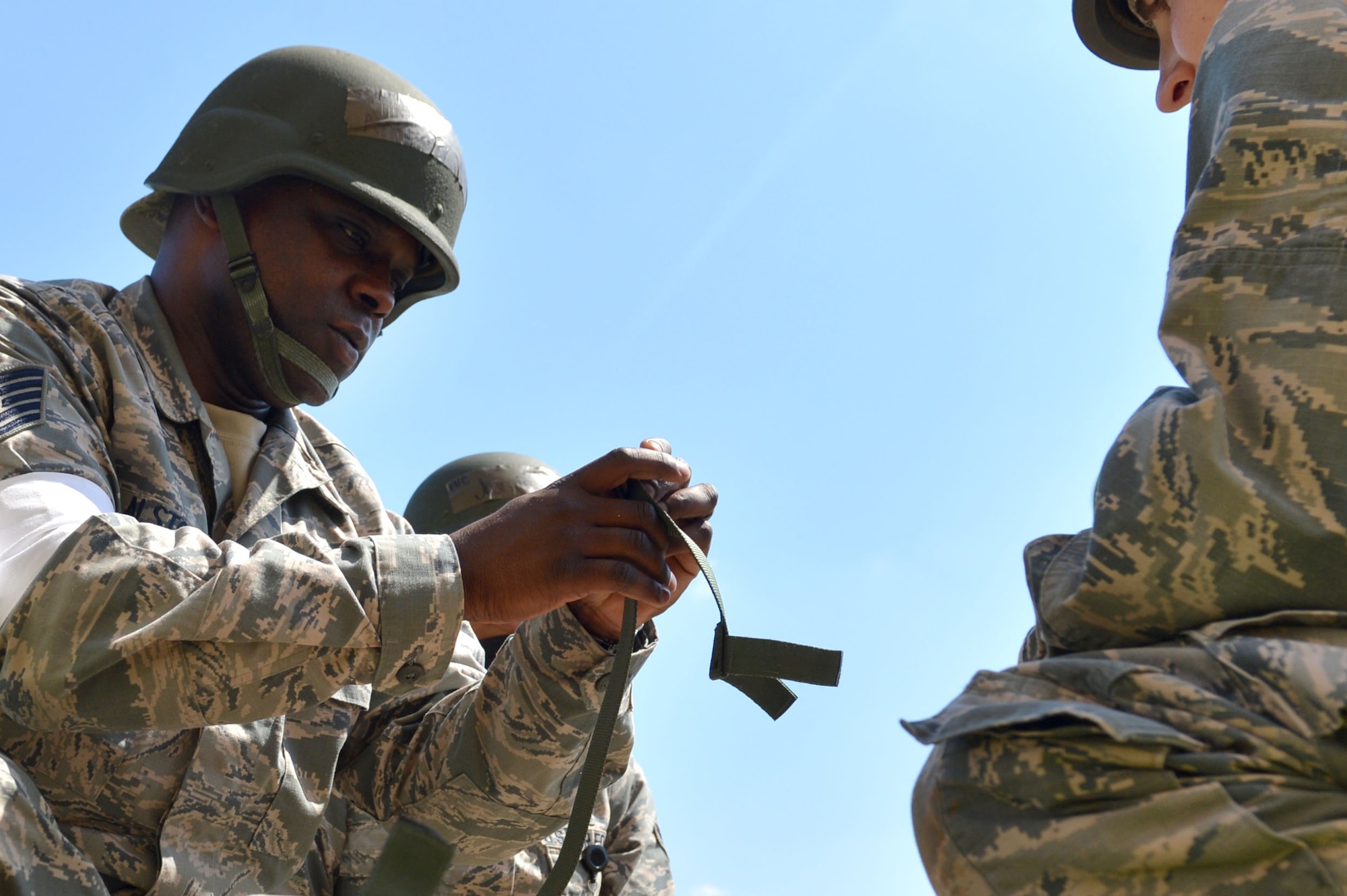 U.S. Air Force Tech. Sgt. Anthony Alston, 20th Medical Operation Support Squadron aerospace medicine service craftsman, secures a litter harness during operational readiness exercise Weasel Victory 17-07 at Shaw Air Force Base, S.C., May 16, 2017. The Airmen were timed on how quickly they could transport the injured and access the site for any unexploded ordnances. (U.S. Air Force photo by Airman 1st Class Christopher Maldonado)