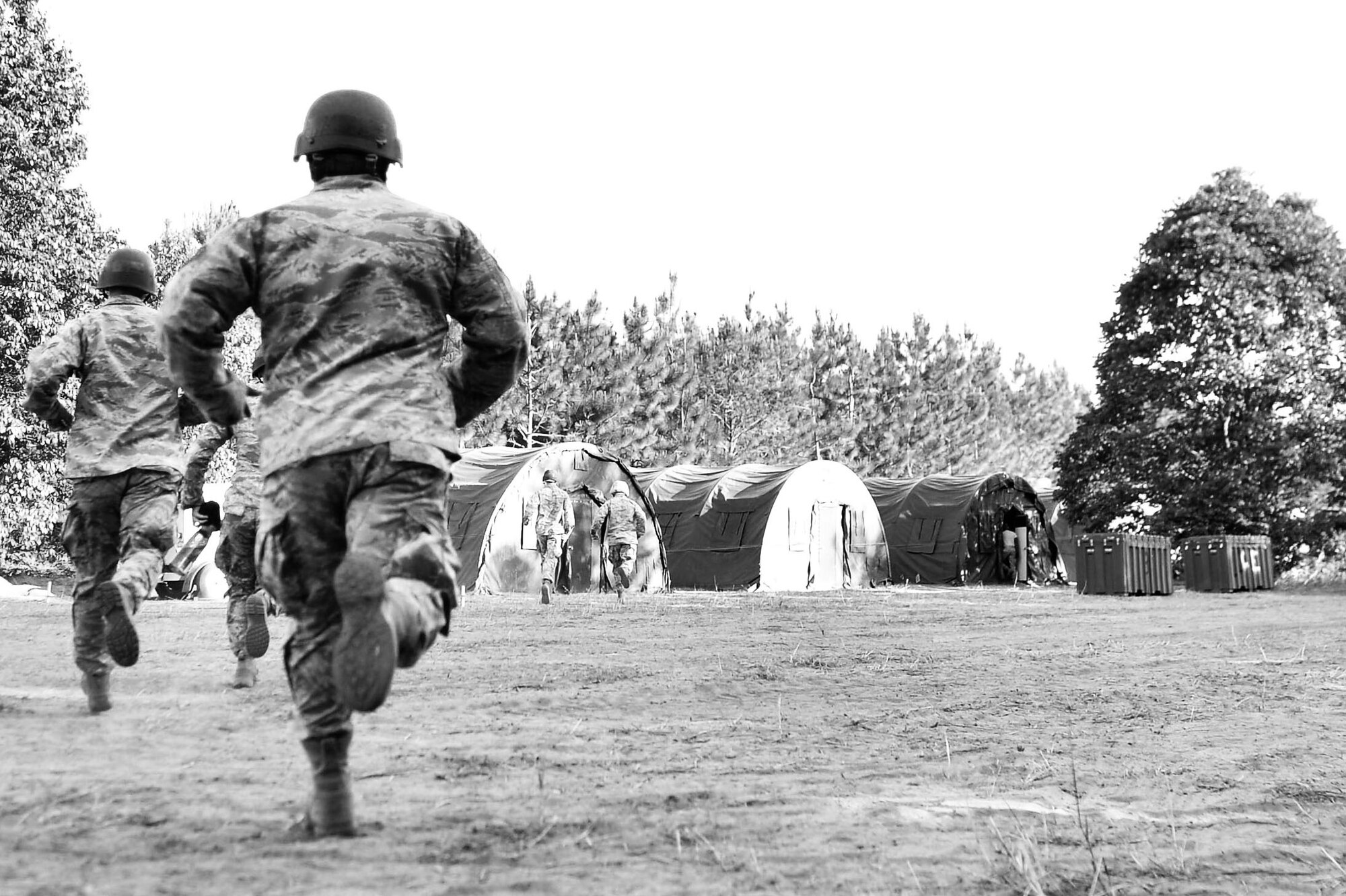 U.S. Airmen assigned to the 20th Fighter Wing run to a hardened shelter, following a simulated explosion during operation readiness exercise Weasel Victory 17-07 at Poinsett Electronic Combat Range, near Wedgefield S.C., May 16, 2017. Throughout the exercise Airmen trained on how to do their respective jobs in a deployed environment with deployment-like scenarios occurring periodically throughout the day. (U.S. Air Force photo by Airman 1st Class Christopher Maldonado)