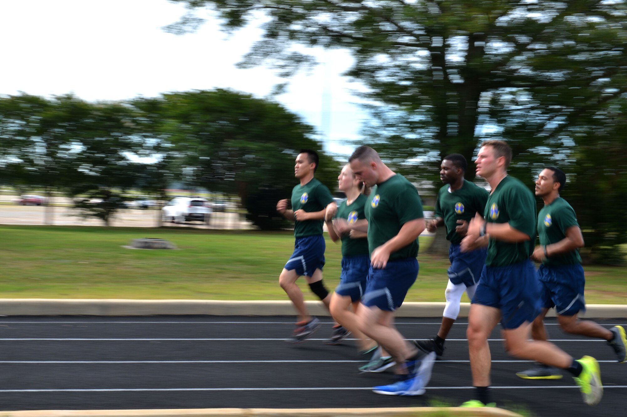 U.S. Airmen assigned to the 20th Medical Support Squadron jog as part of the 1.5 miles suppression of enemy air defense (SEAD) relay race during the 20th Operations Group-hosted warrior day combat challenge at Shaw Air Force Base, S.C., May 19, 2017. During this final event, Airmen competed for the fastest times while participating in a simulated SEAD mission. (U.S. Air Force photo by Airman 1st Class Christopher Maldonado)